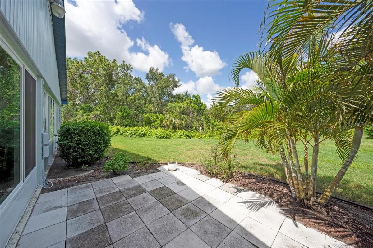Lush landscaping surrounds the property
