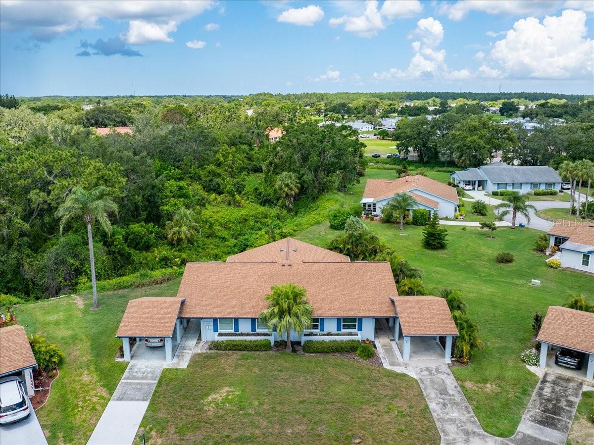 Serene landscaping surrounded by palms and private backyard. Driveway to be resurfaced and refinished up to the carport. Come back 511 Foxglove Cir Unit B HOME!
