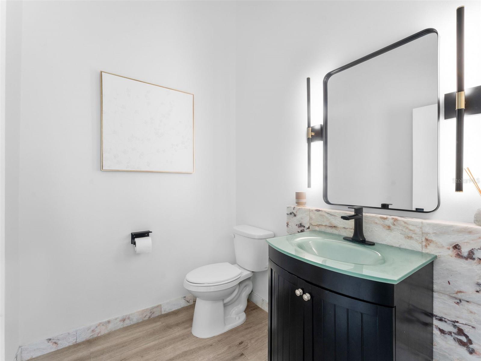Powder Bath by pool entry near Family Room