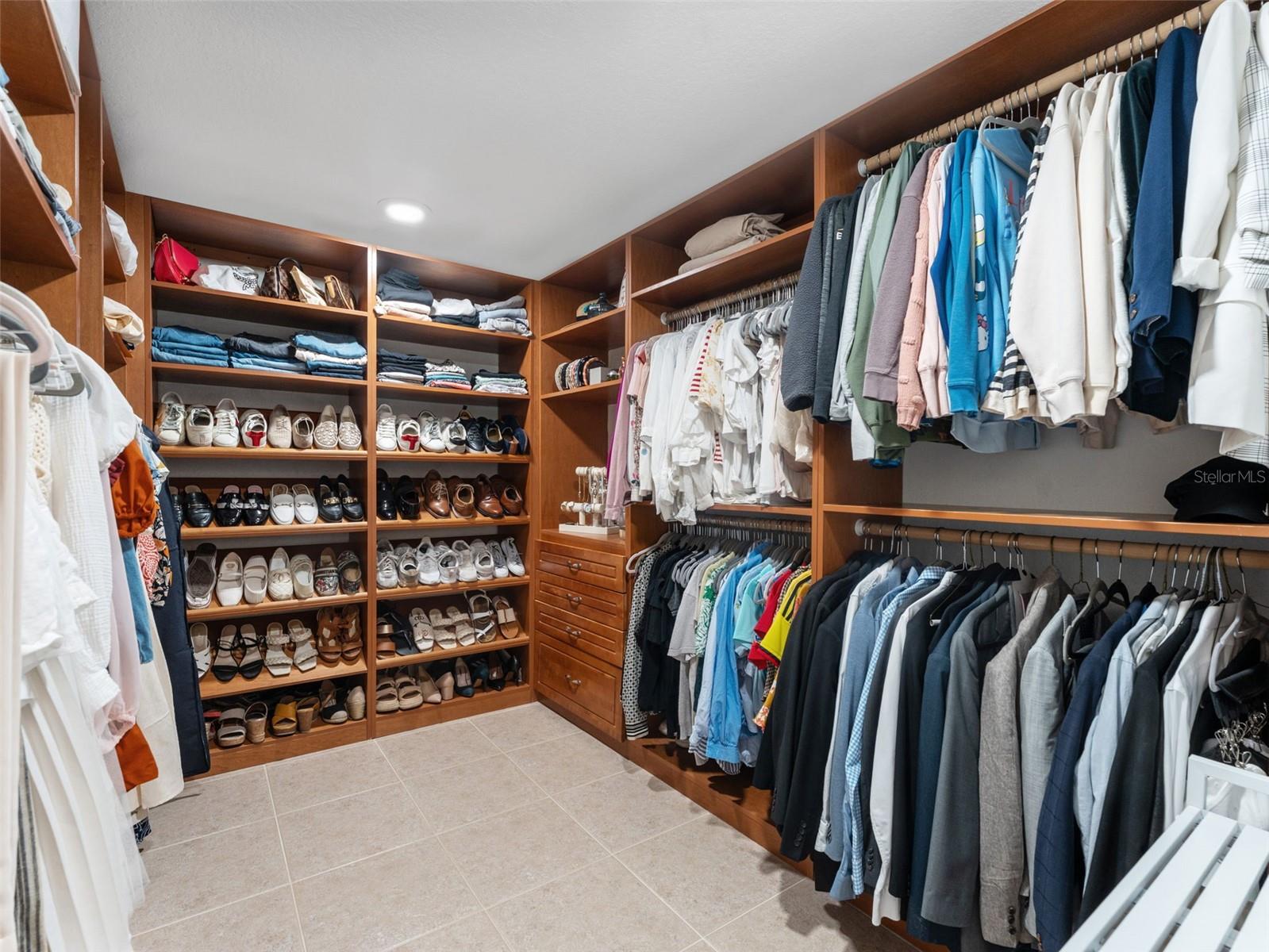 One of two custom closets in the Primary Suite