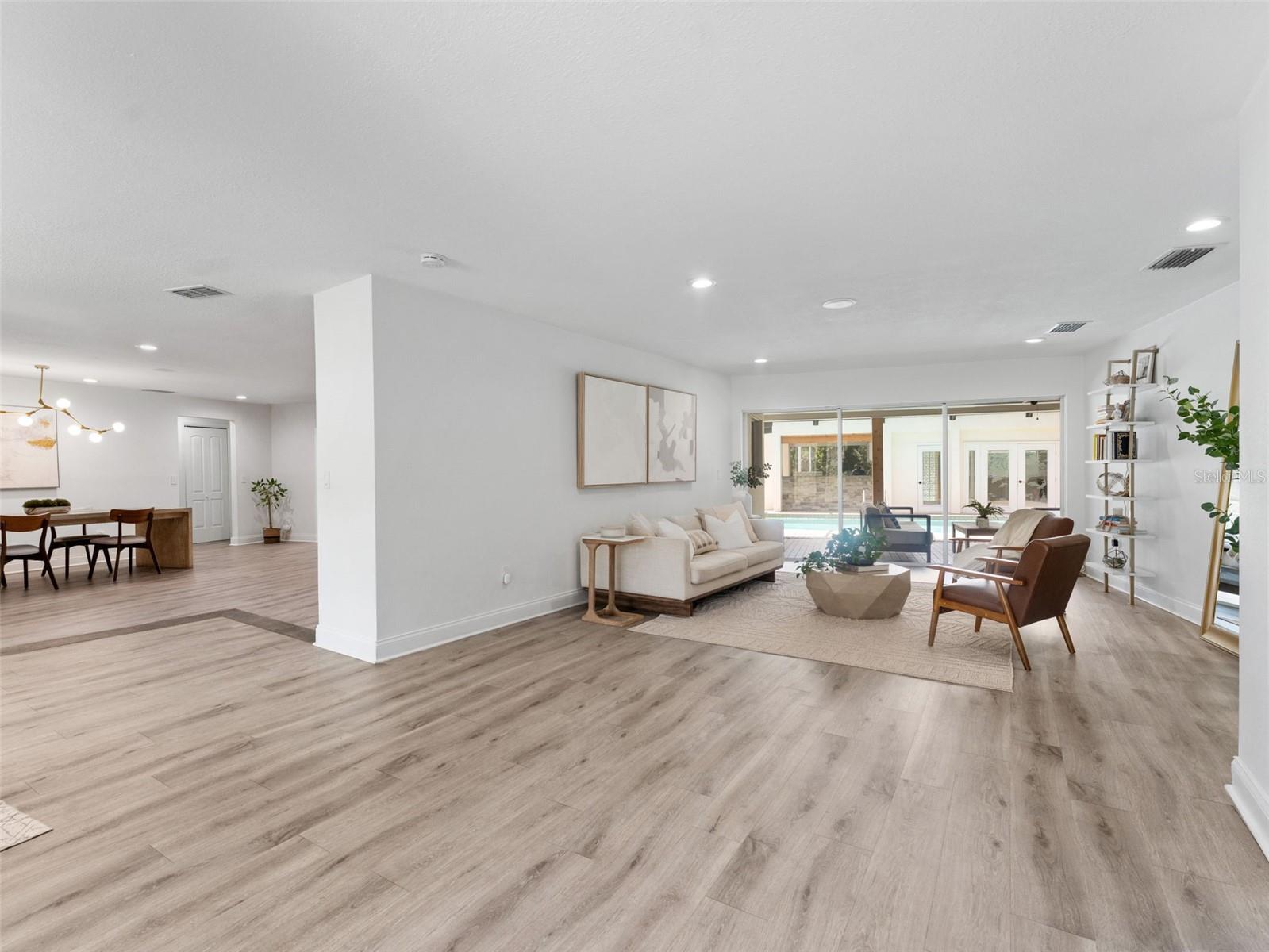 Formal Living Room with large sliders out to the pool