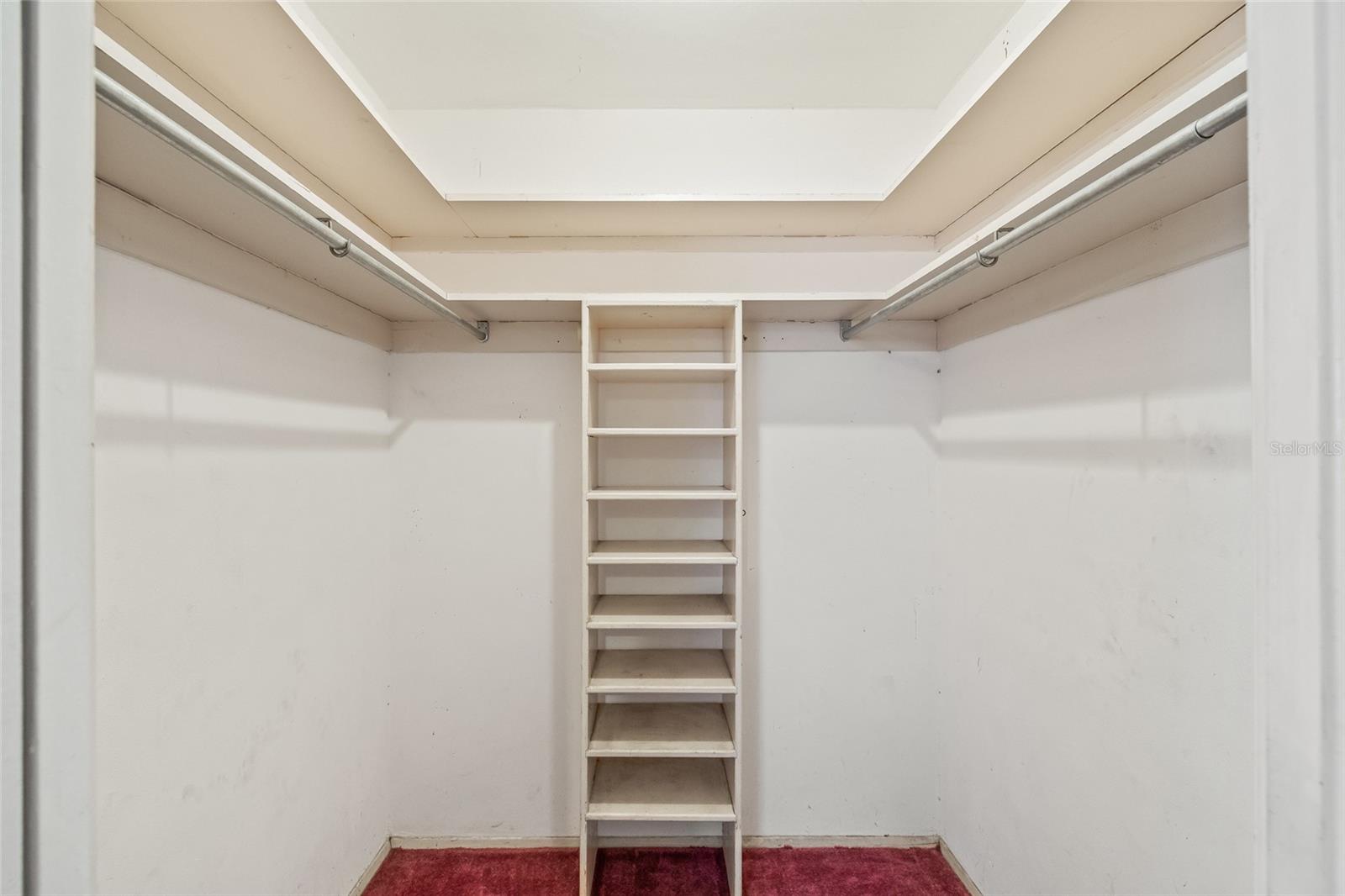 Walk in closet in primary bedroom