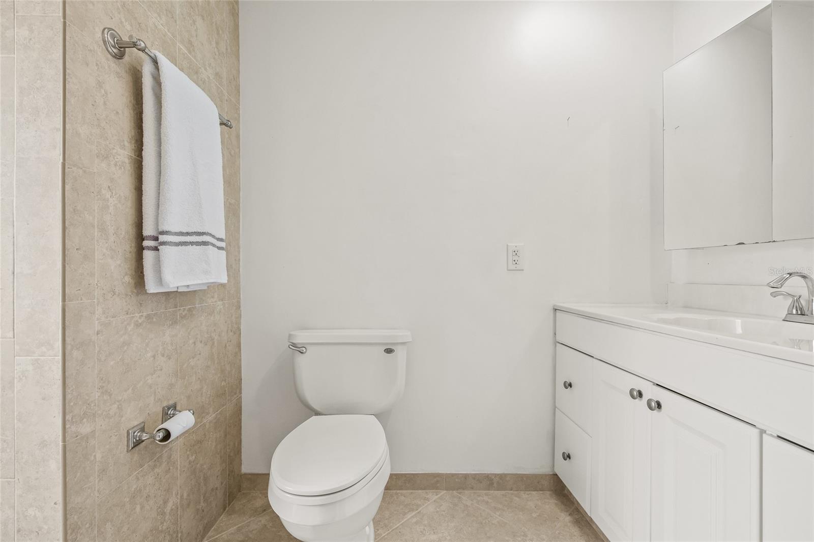 Primary bathroom with vanity and walk in shower