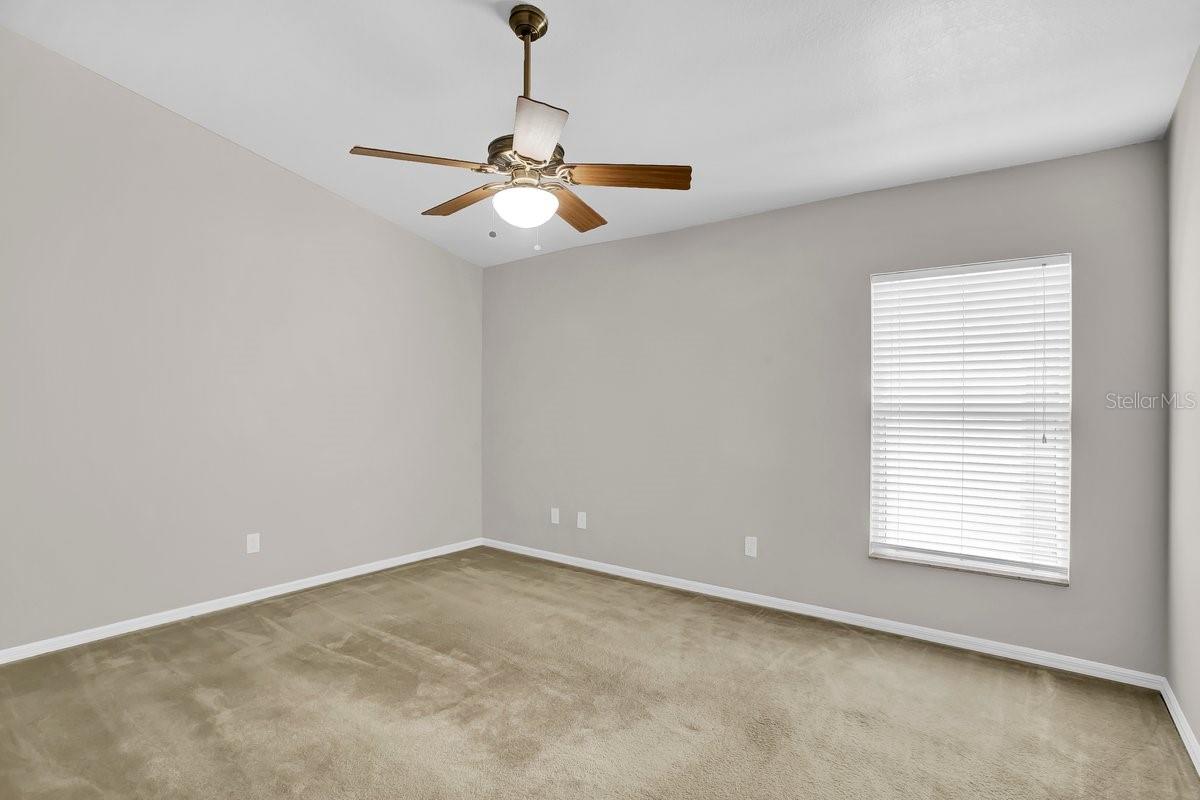 Primary bedroom w/vaulted ceilings