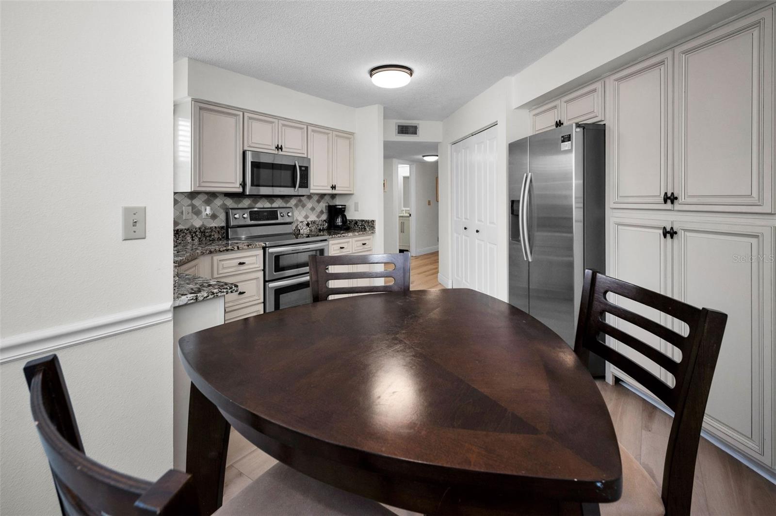 A view of the kitchen from the dinette area