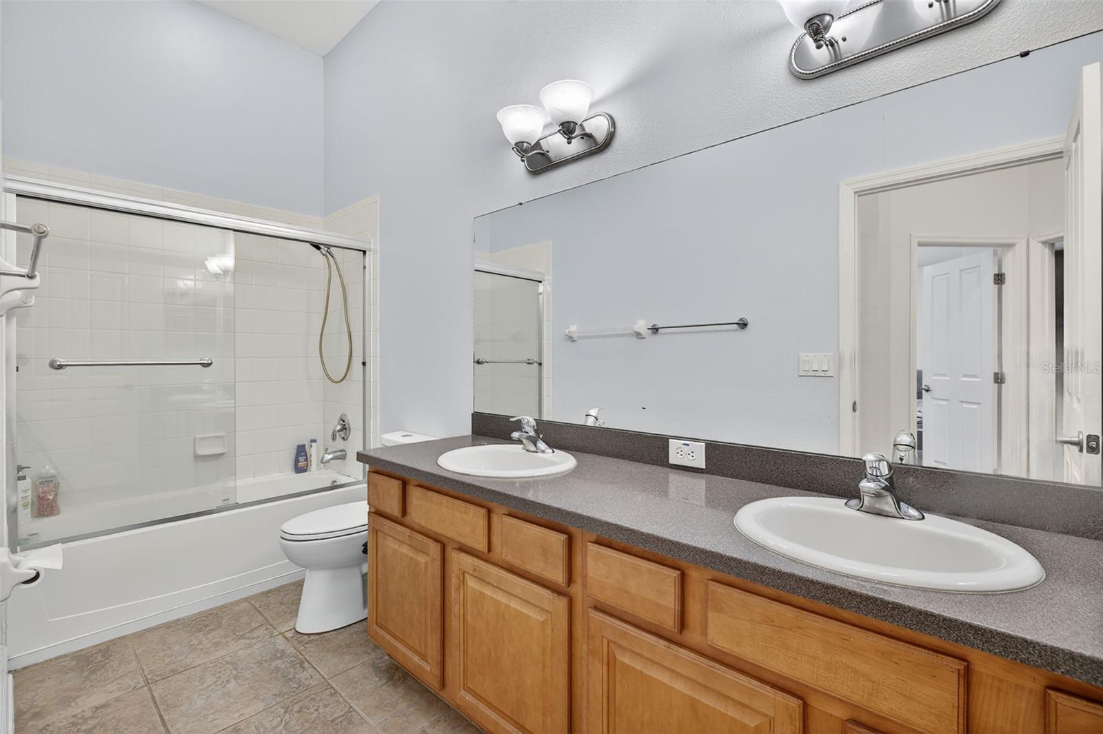 Hall bathroom with double sinks