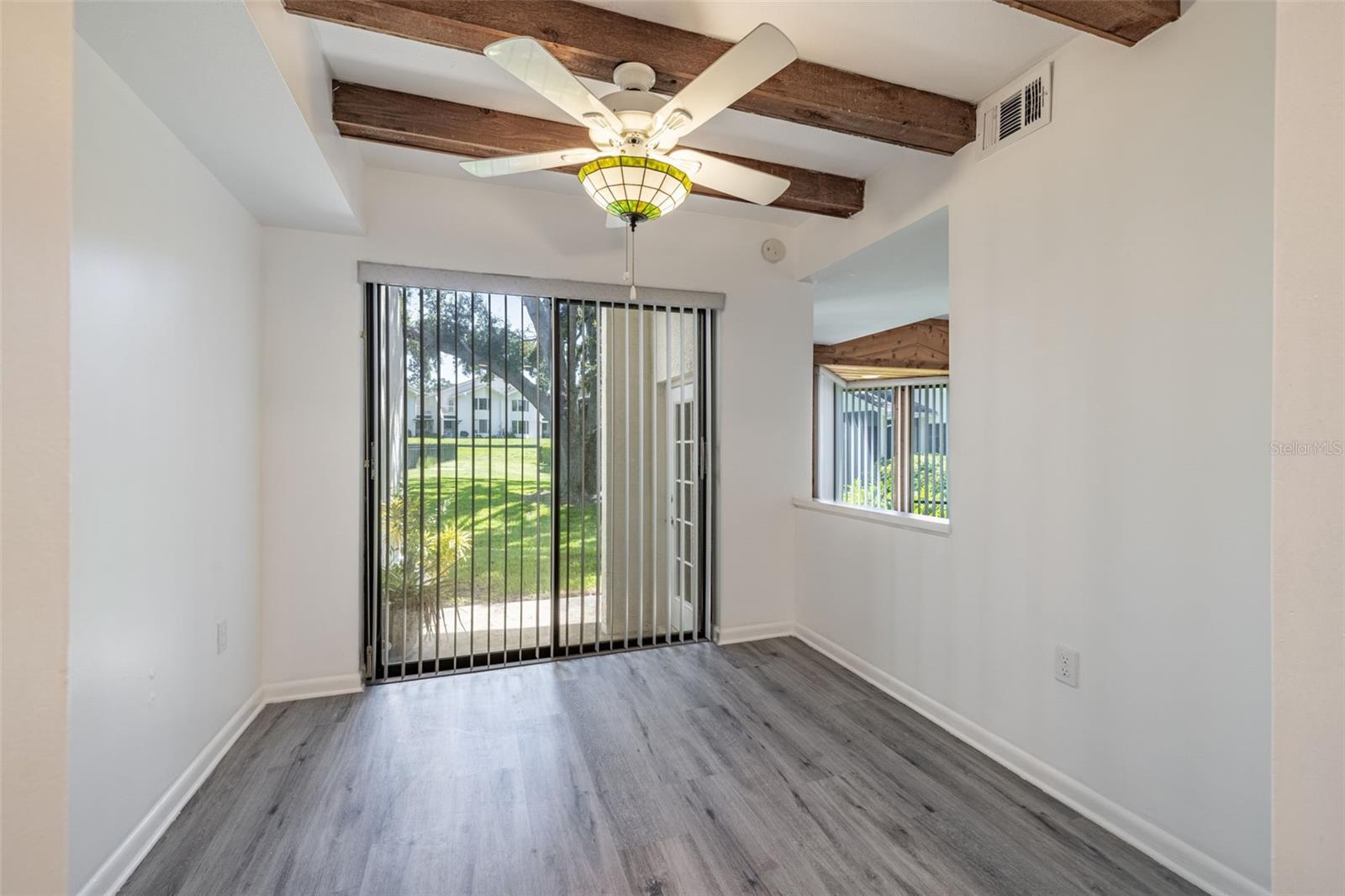 Eat In Kitchen Space with Sliders to Exterior Patio