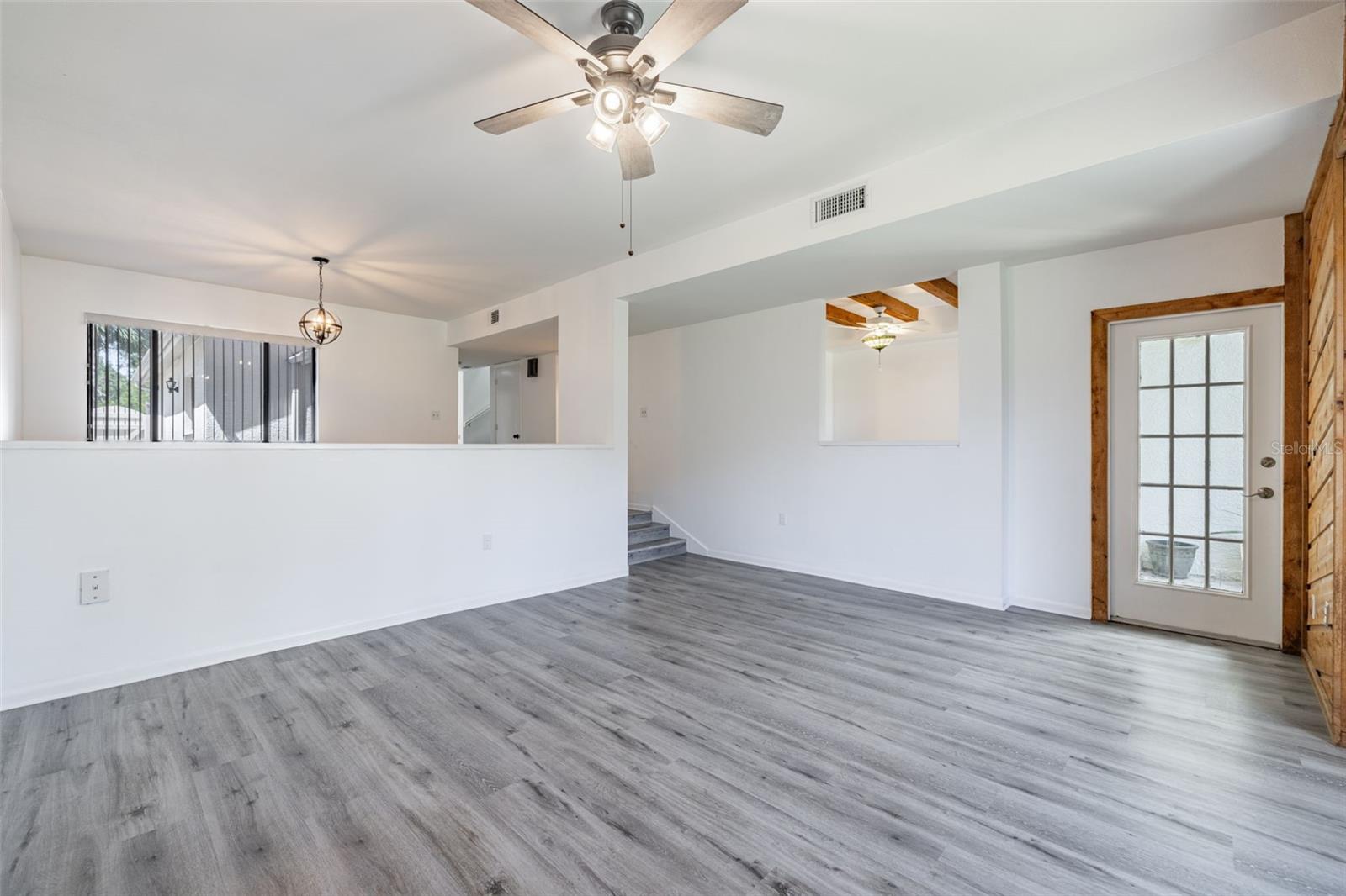 Living Room, looking back to Dining Area & Exterior Door