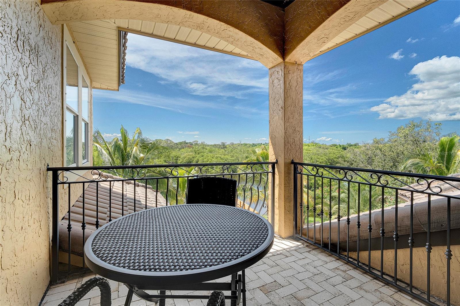 Juliet balcony off movie theater overlooking pool and water views