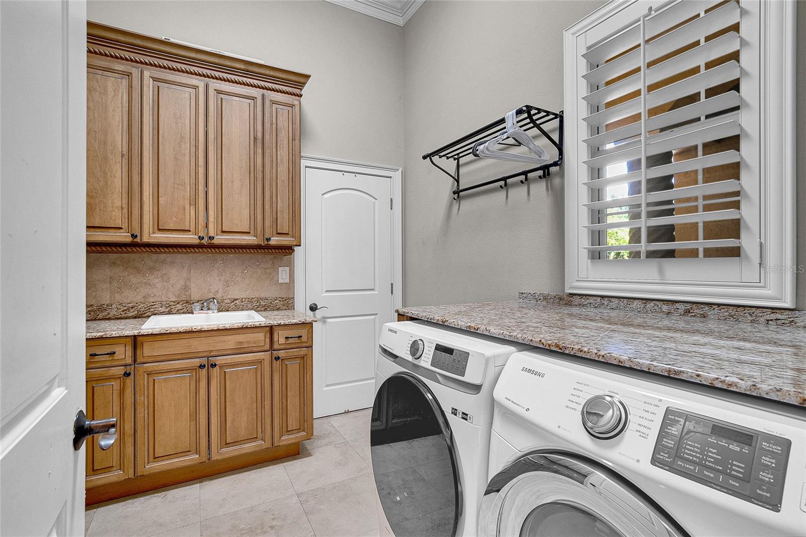 Laundry room with storage closet