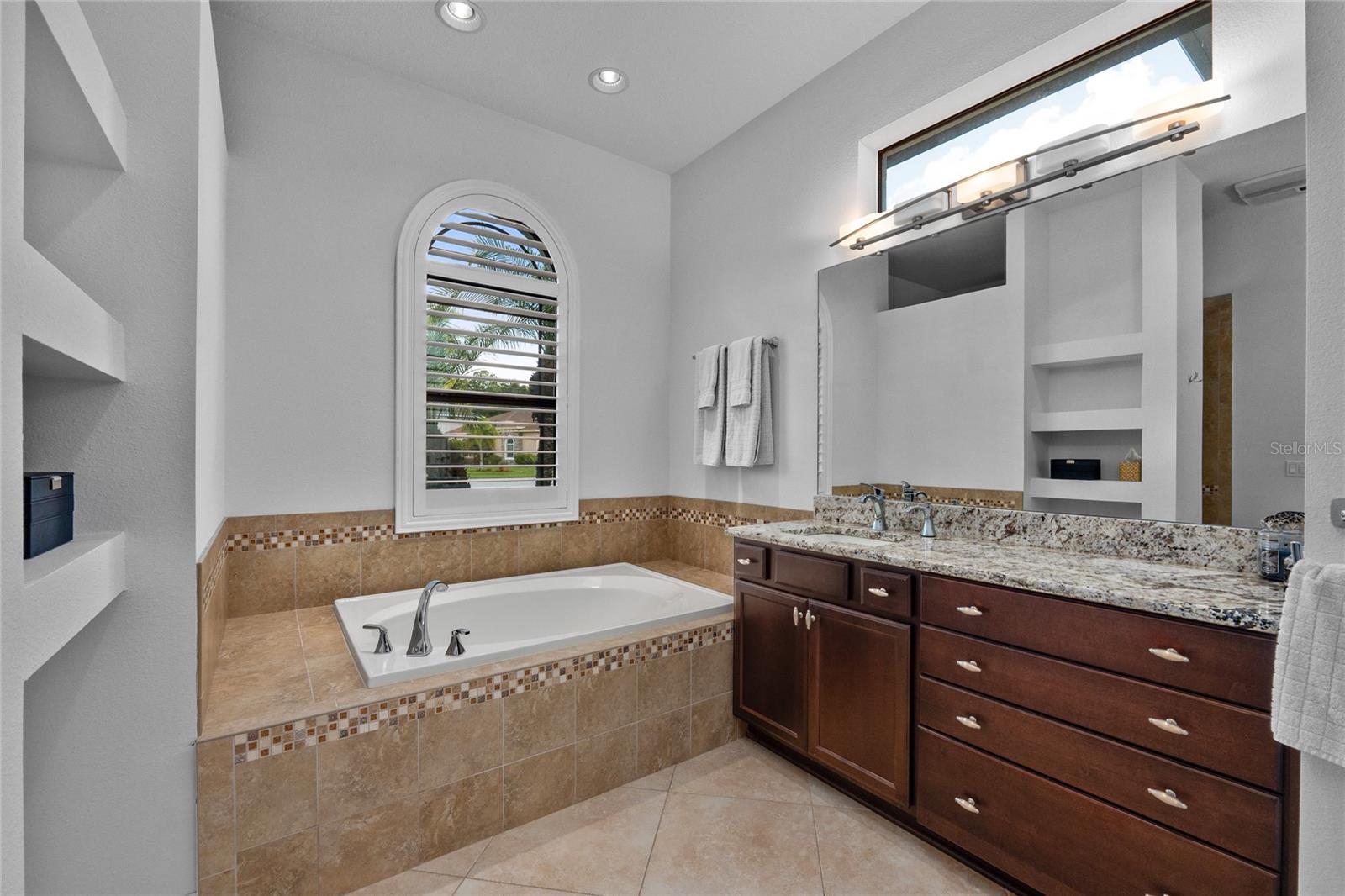 Large tub, dual oversized vanities with lots of storage
