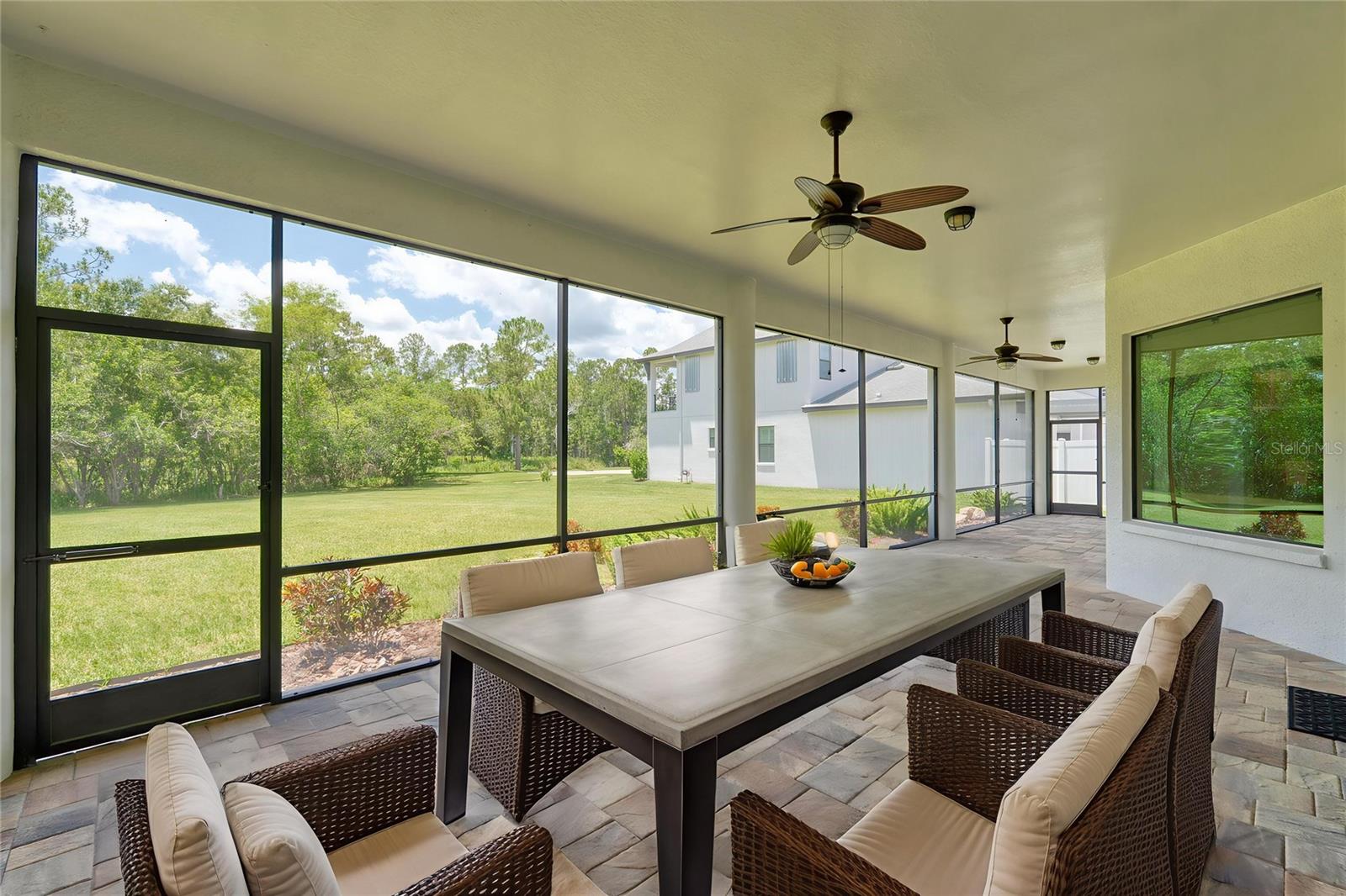 Huge screened lanai with view of the private back yard.