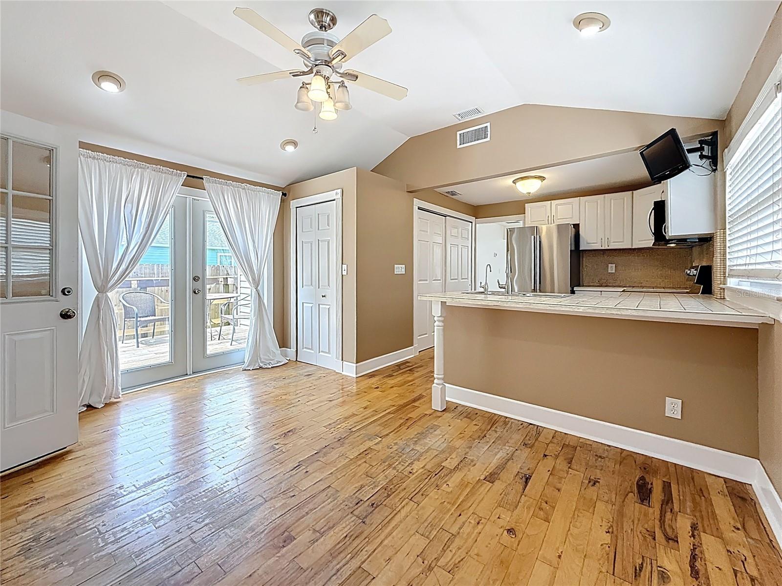 View from dining area towards kitchen and french doors