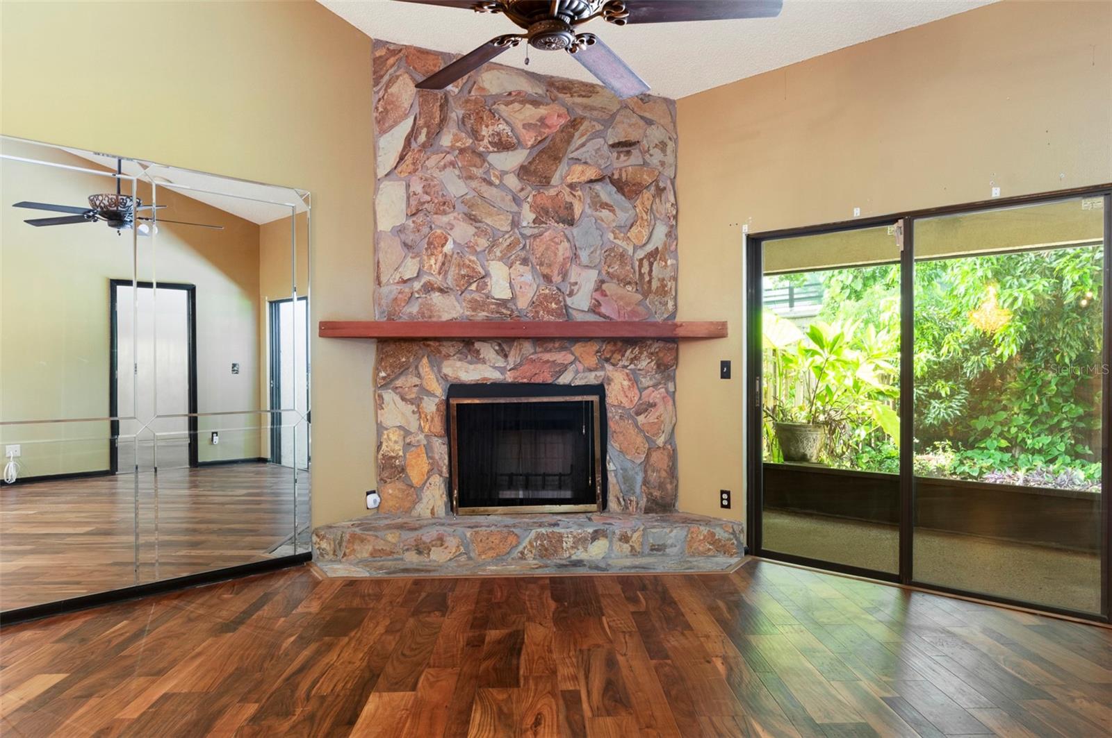 Fireplace and beyond, a lush landscape in your private yard.