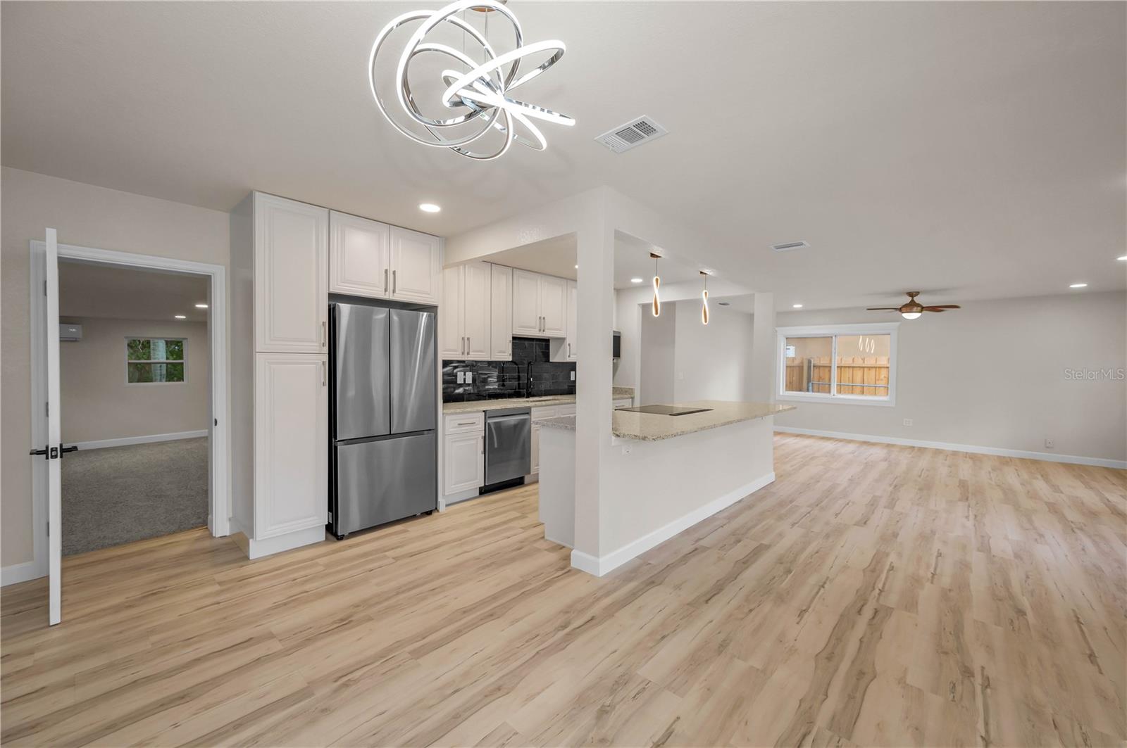 Looking back from dining room to entry on the left to bonus room