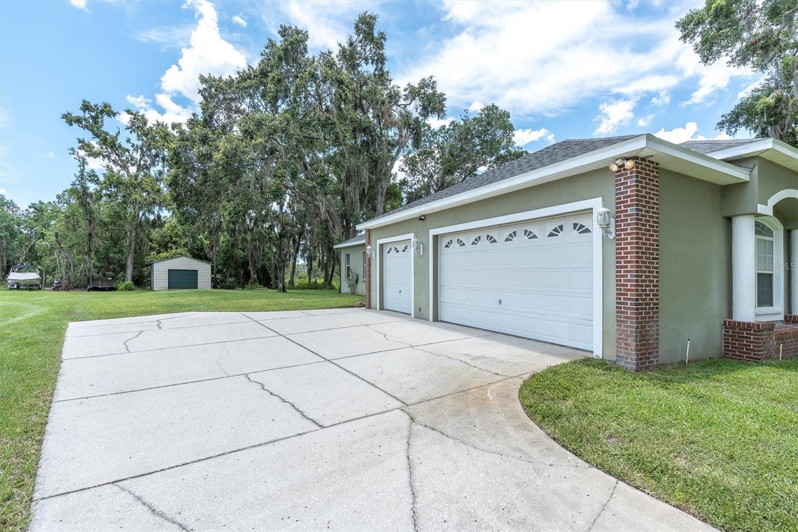 AN ABUNDANCE OF PARKING & OVERSIZED GARAGE