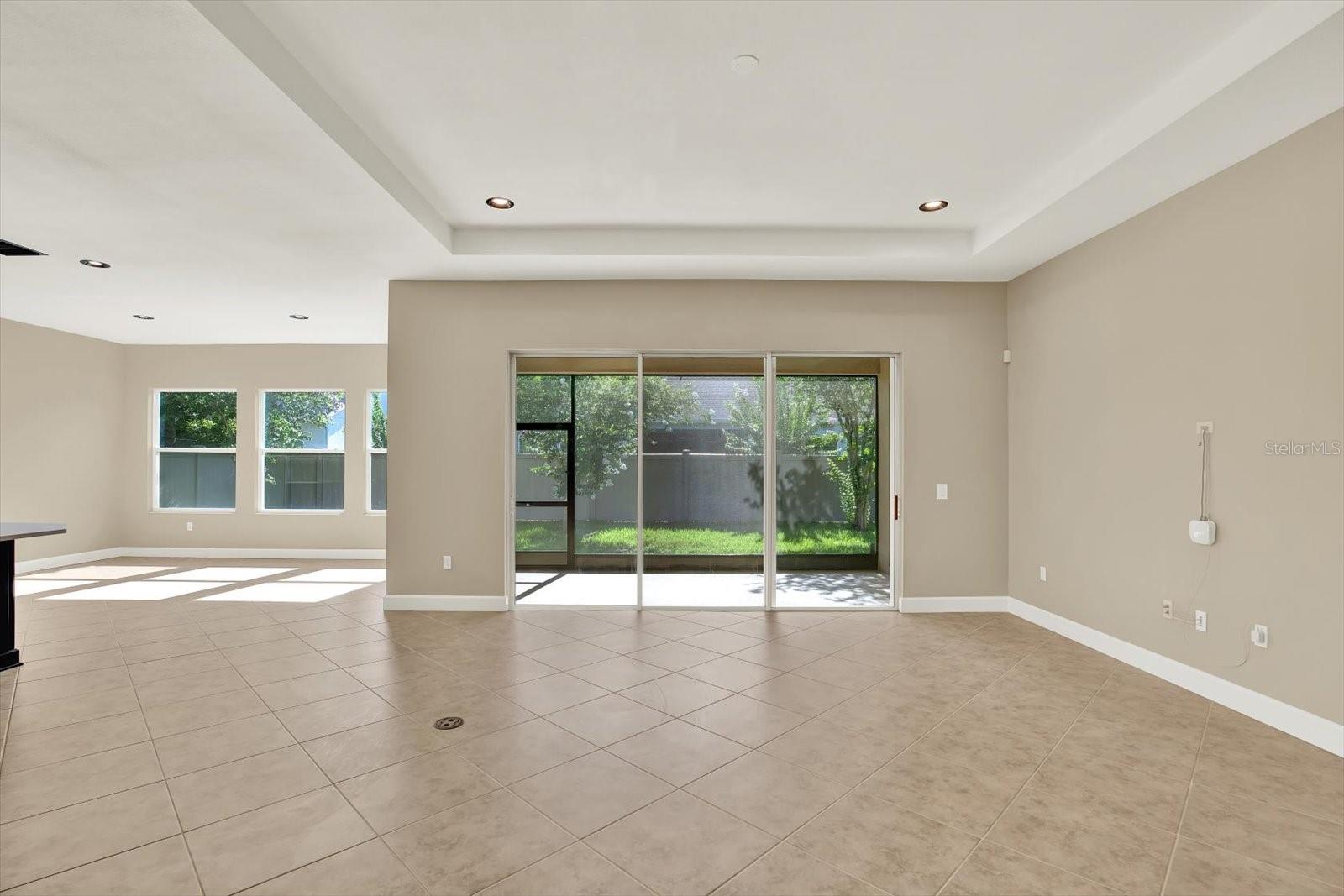 Triple sliders lead to screened lanai
