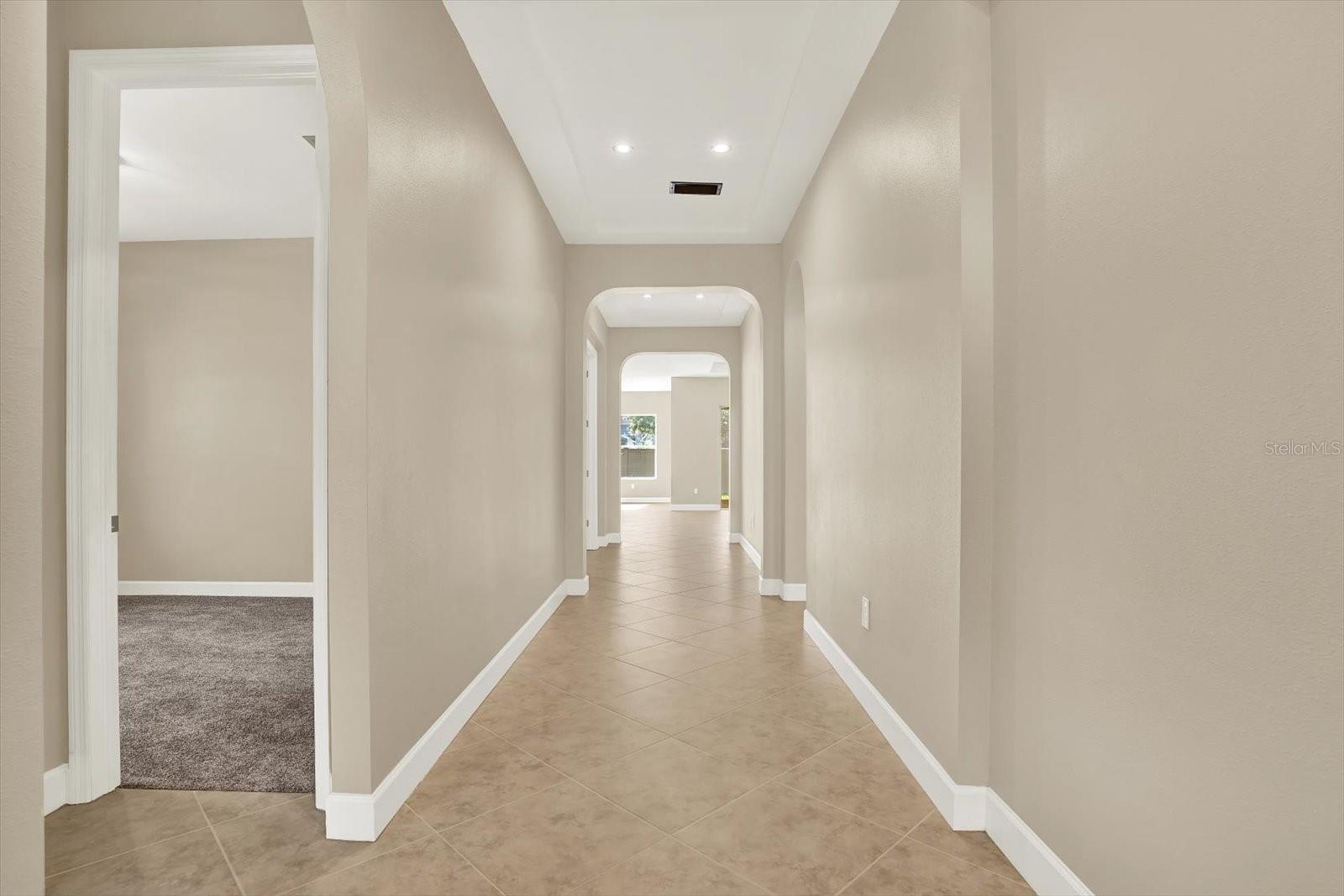 Front hallway with tray ceiling