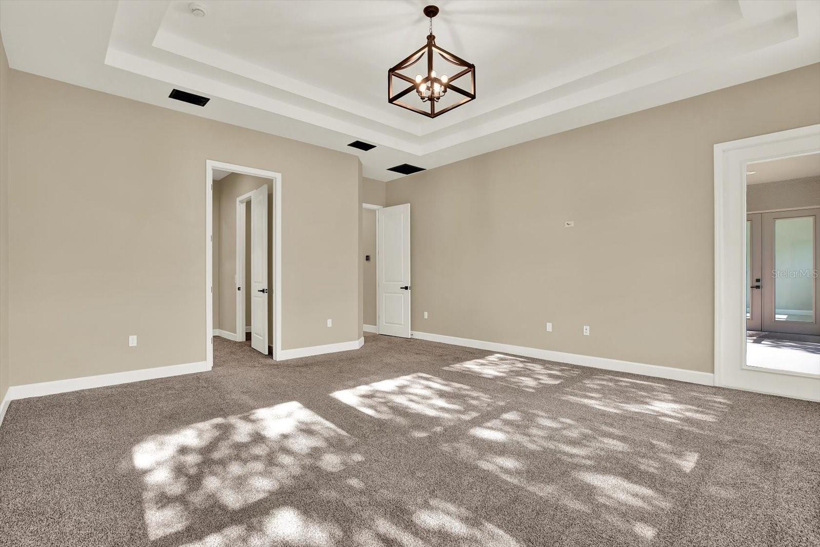 Door to the dual walk-in closets and ensuite bathroom