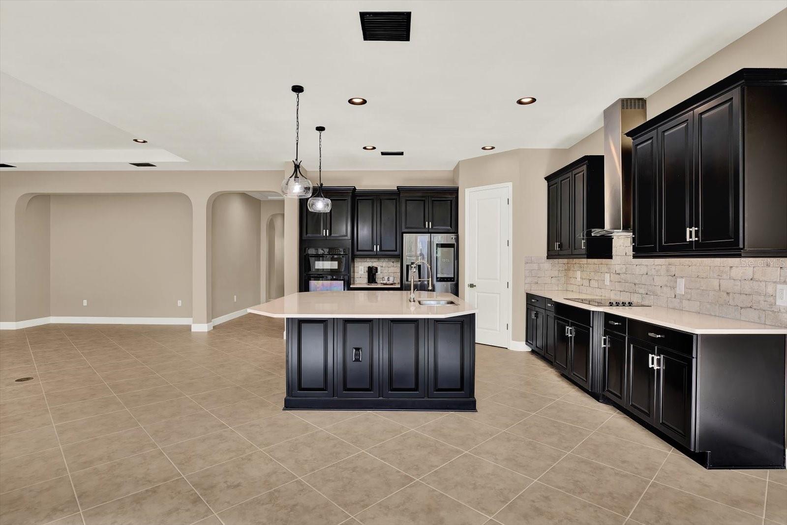 Walk-in pantry with custom wood shelves