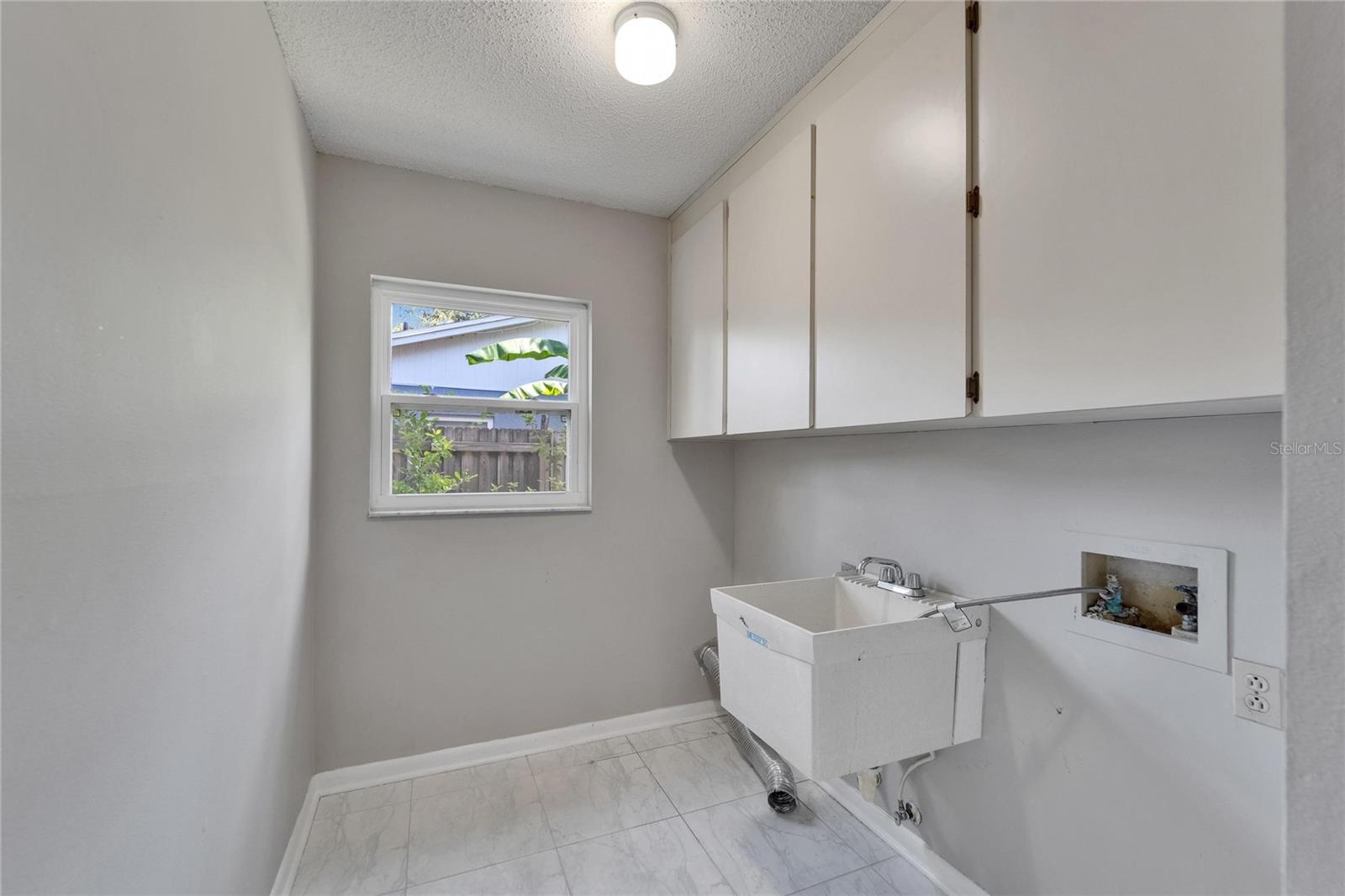 Laundry room with Storage and Utility Sink