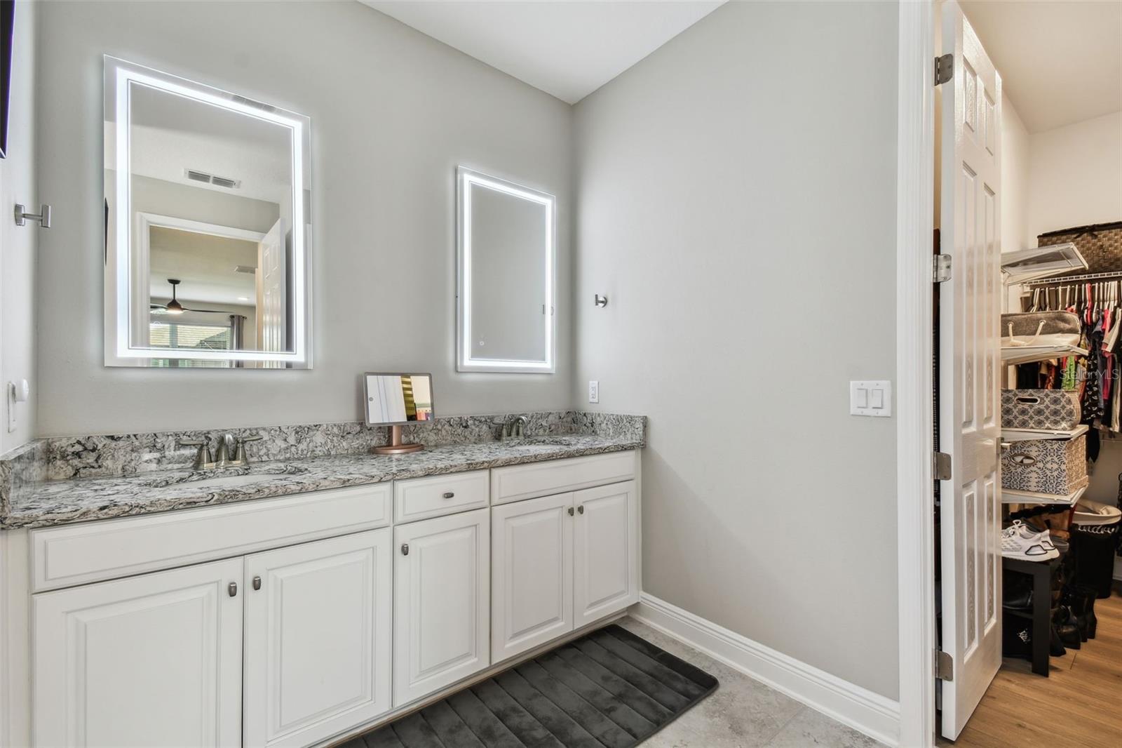 Owner's bathroom, with double sinks, separate toilet, and spacious shower.