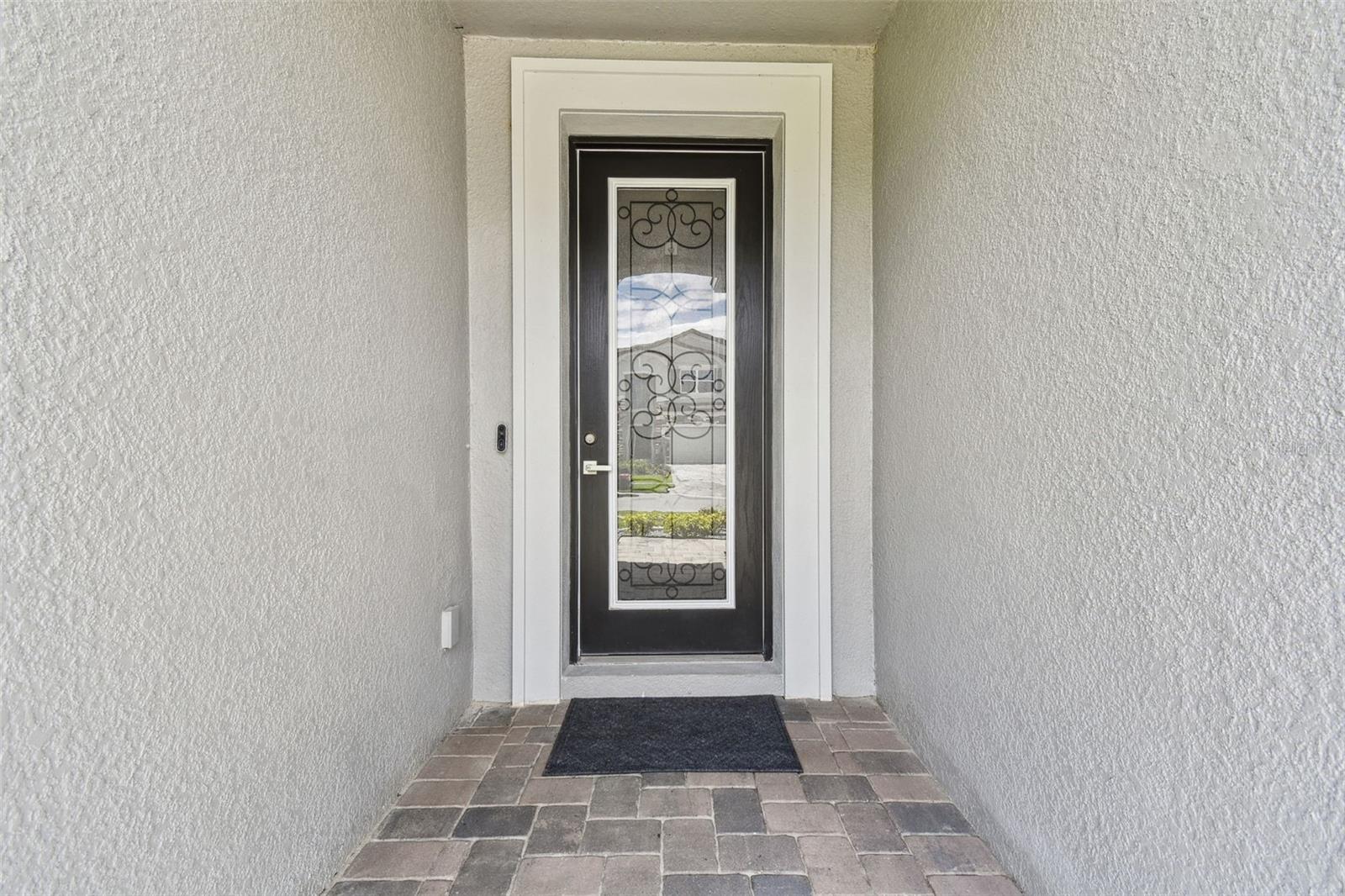 Covered entryway- perfect for those Amazon deliveries to be out of the rain and added security with the video doorbell.