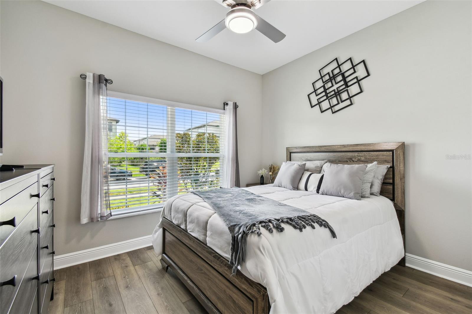 By the front door hallway are two adjoining bedrooms, with a shared bathroom