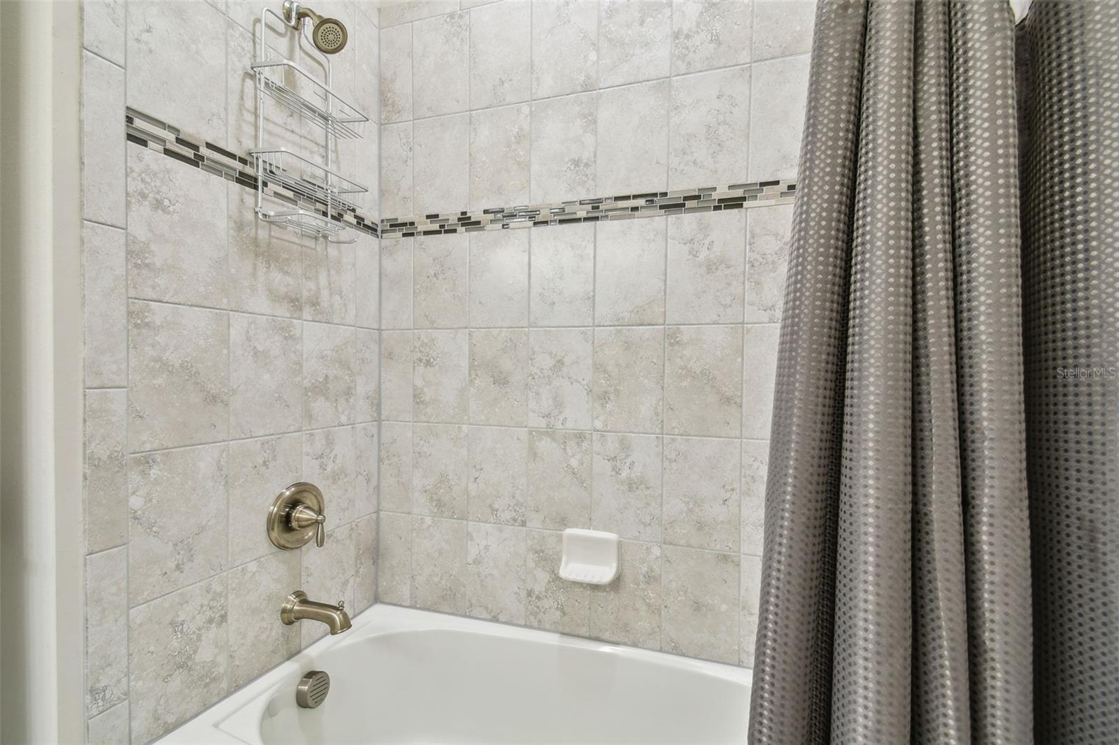 Listello tile border adds style to this bath, and easy colors to live with.