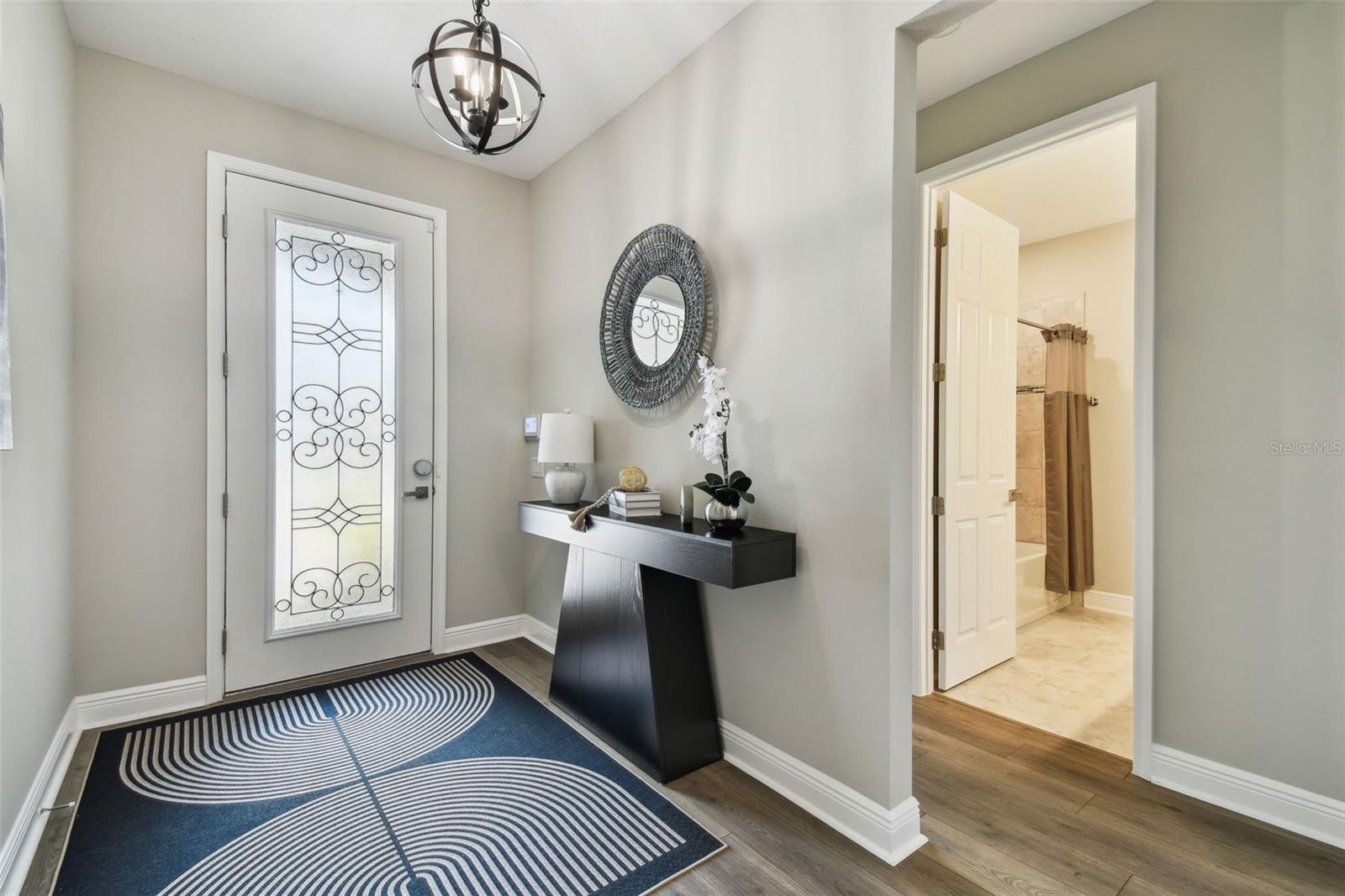 Welcoming entry - and hallway to two bedrooms and a full bathroom