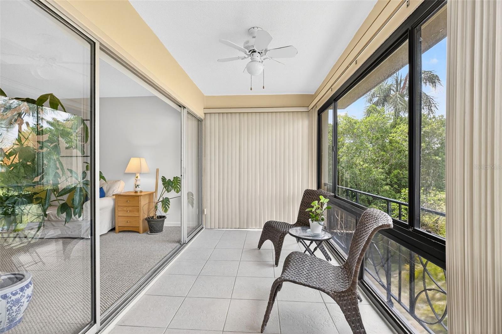 Glass Enclosed Patio with Ceiling Fans.    Open the windows in Spring/Fall/Winter to feel the fresh air.