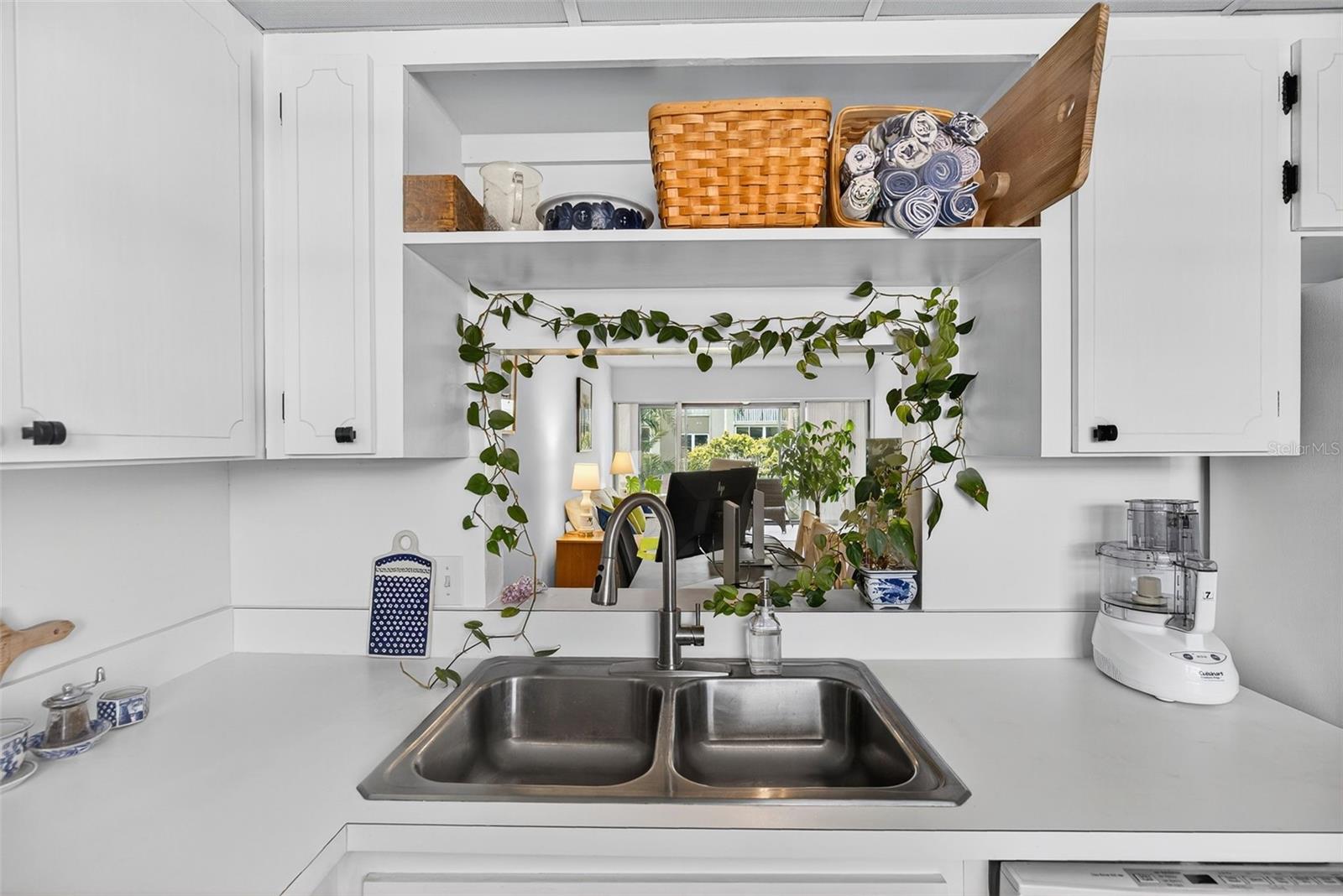 View from Kitchen to Living/Dining/Enclosed Patio areas.