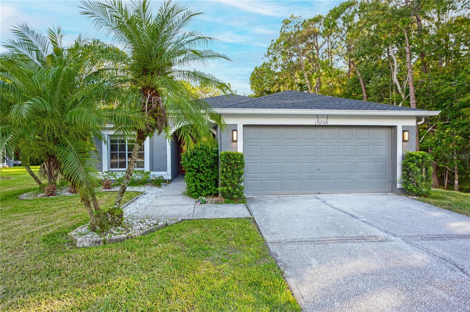Large wooded back and side yard!