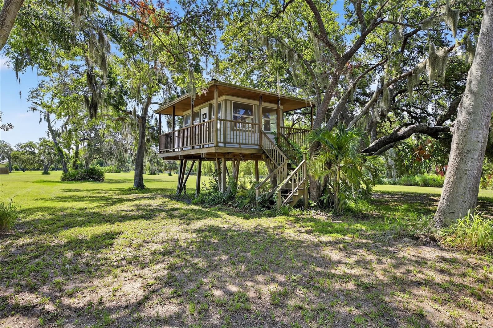 Check out the tree house with a wrap around porch!