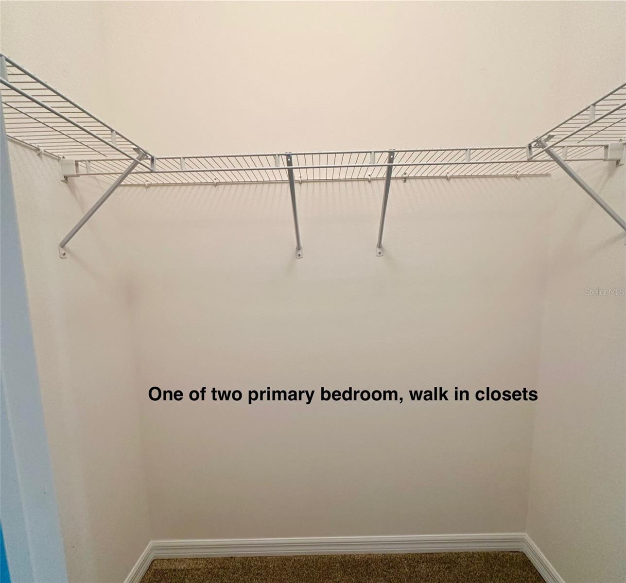 Primary bedroom walk-in closet