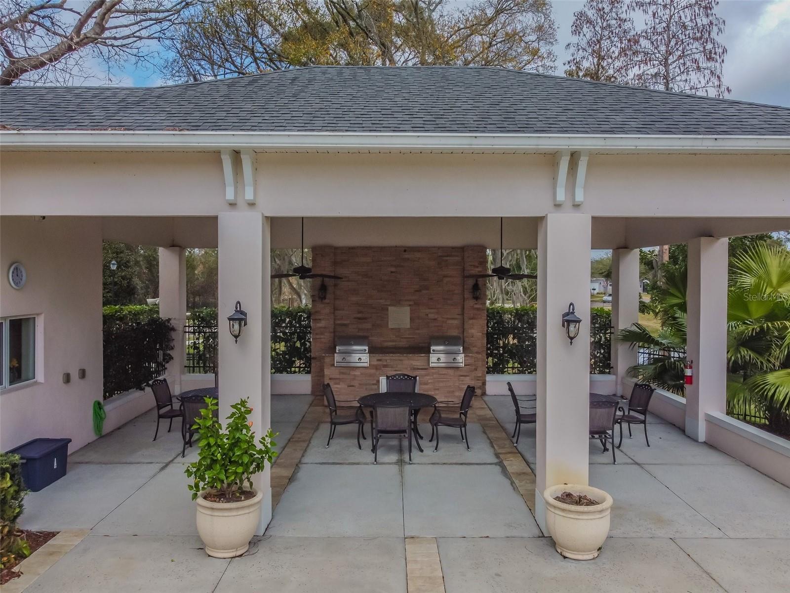 Outdoor grills and covered lanai w tables