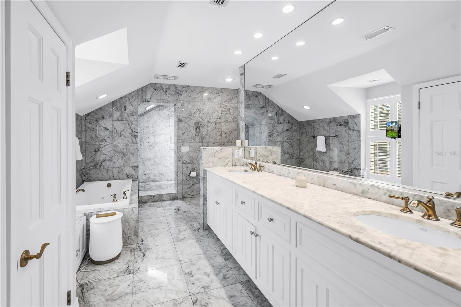 Primary bedroom bathroom, shower and Jacuzzi tub