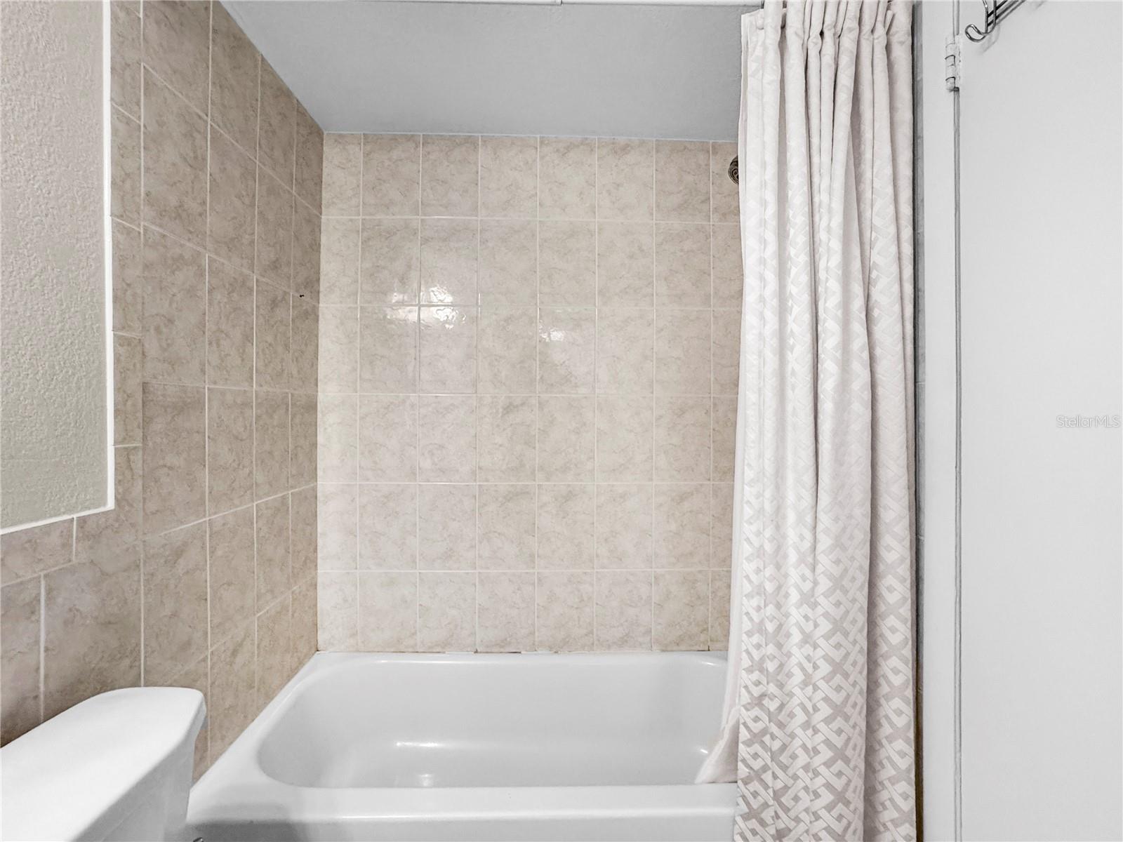 BATHROOM TUB AND SHOWER