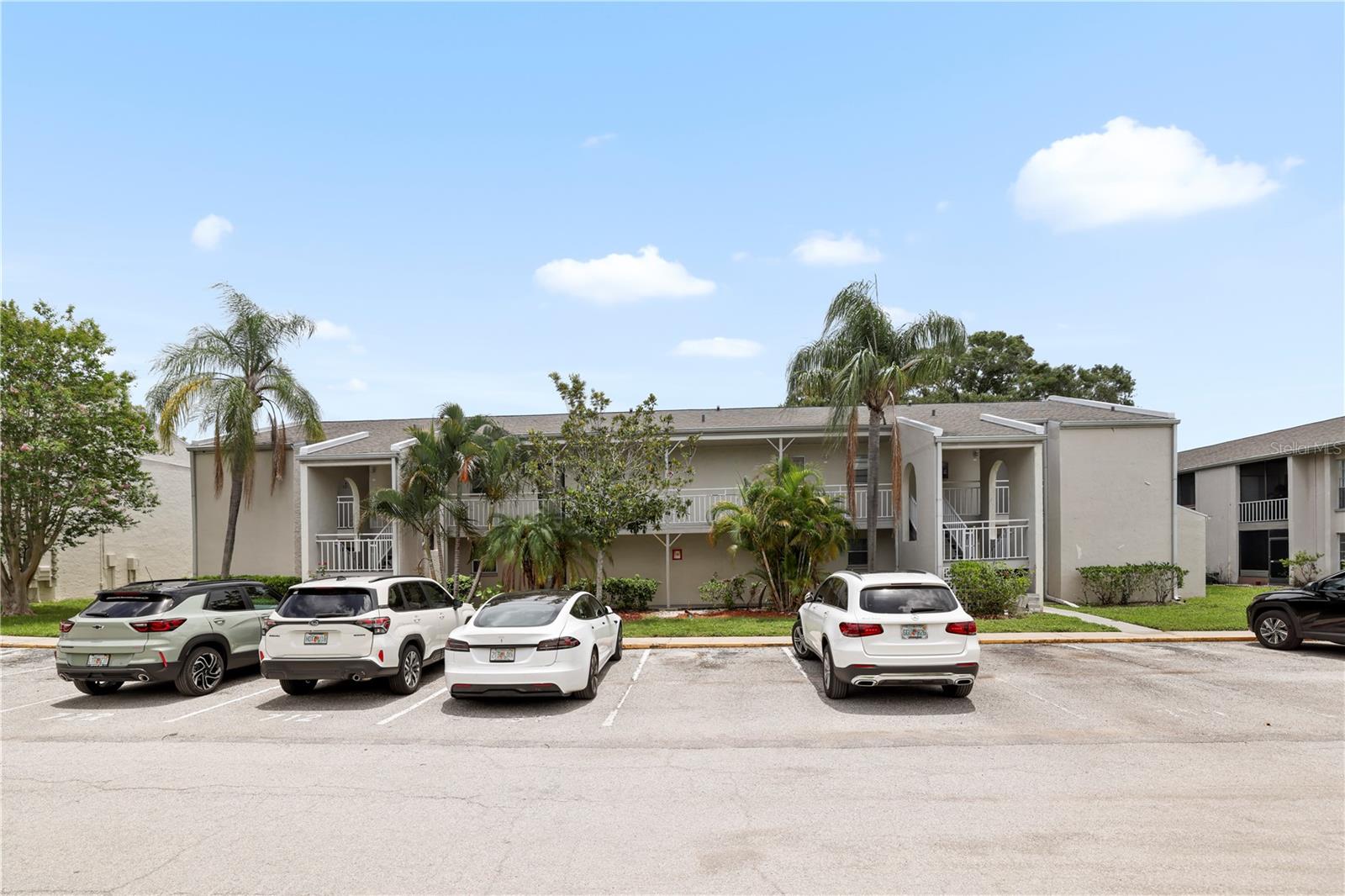 BUILDING FRONT WITH RESERVED AND GUEST PARKING