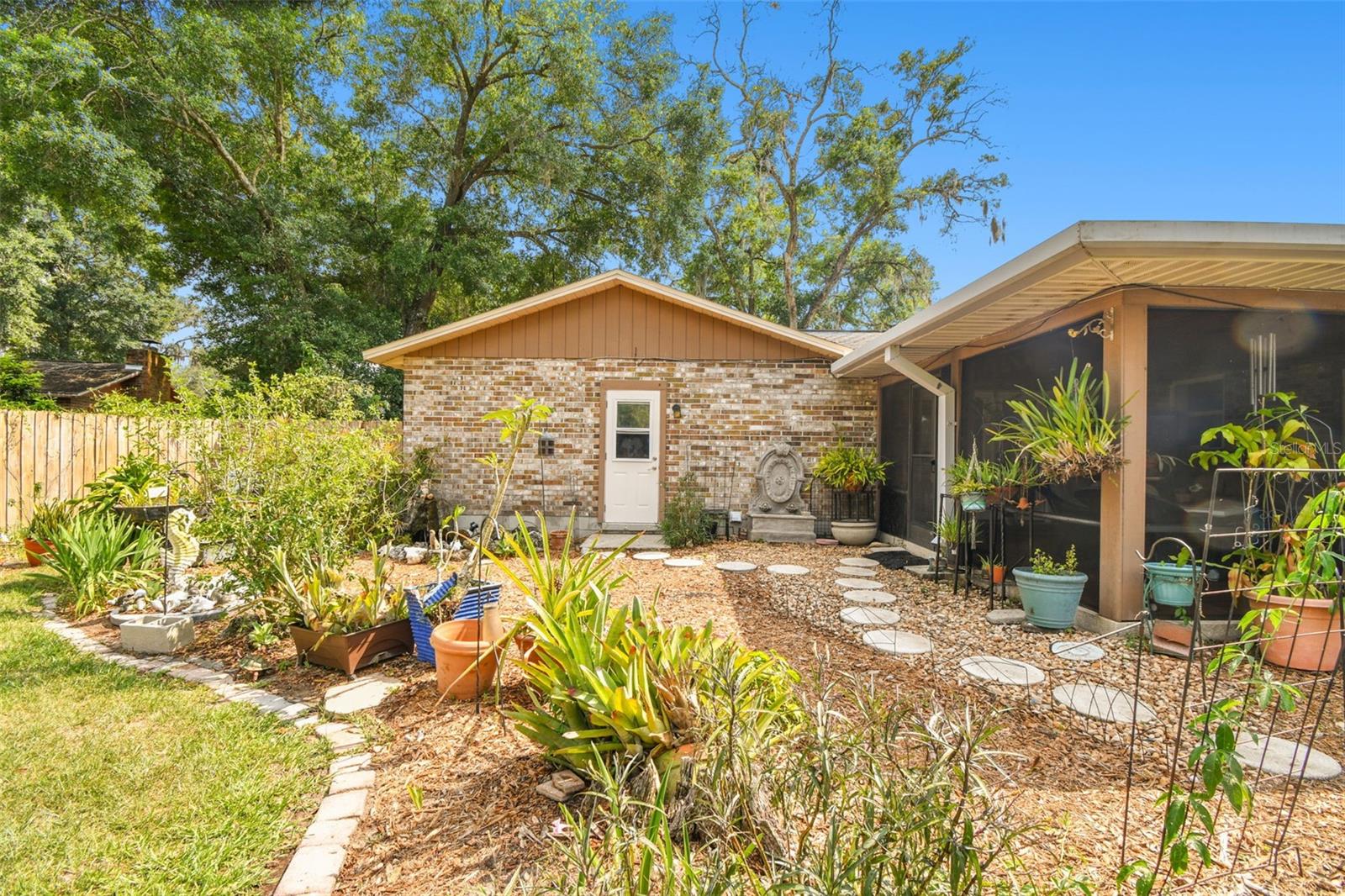 Beautifully landscaped backyard with fruit trees
