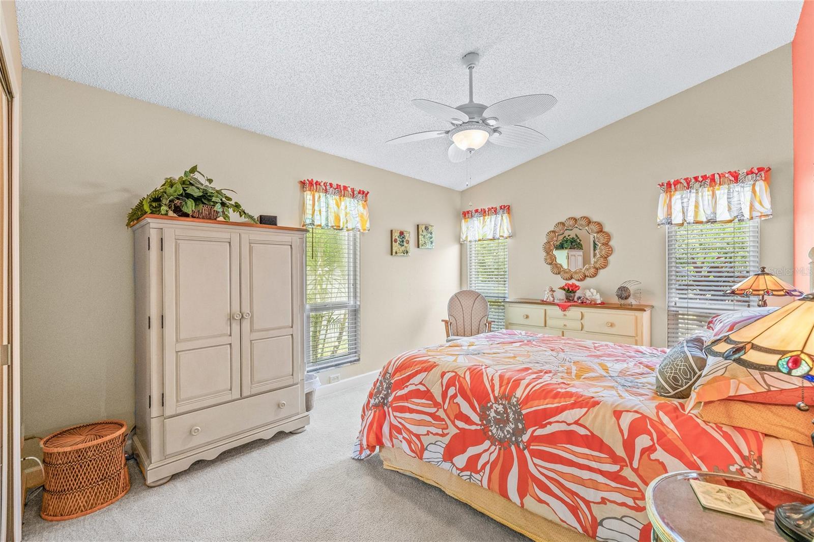 Spacious bedroom with serene preserve views.