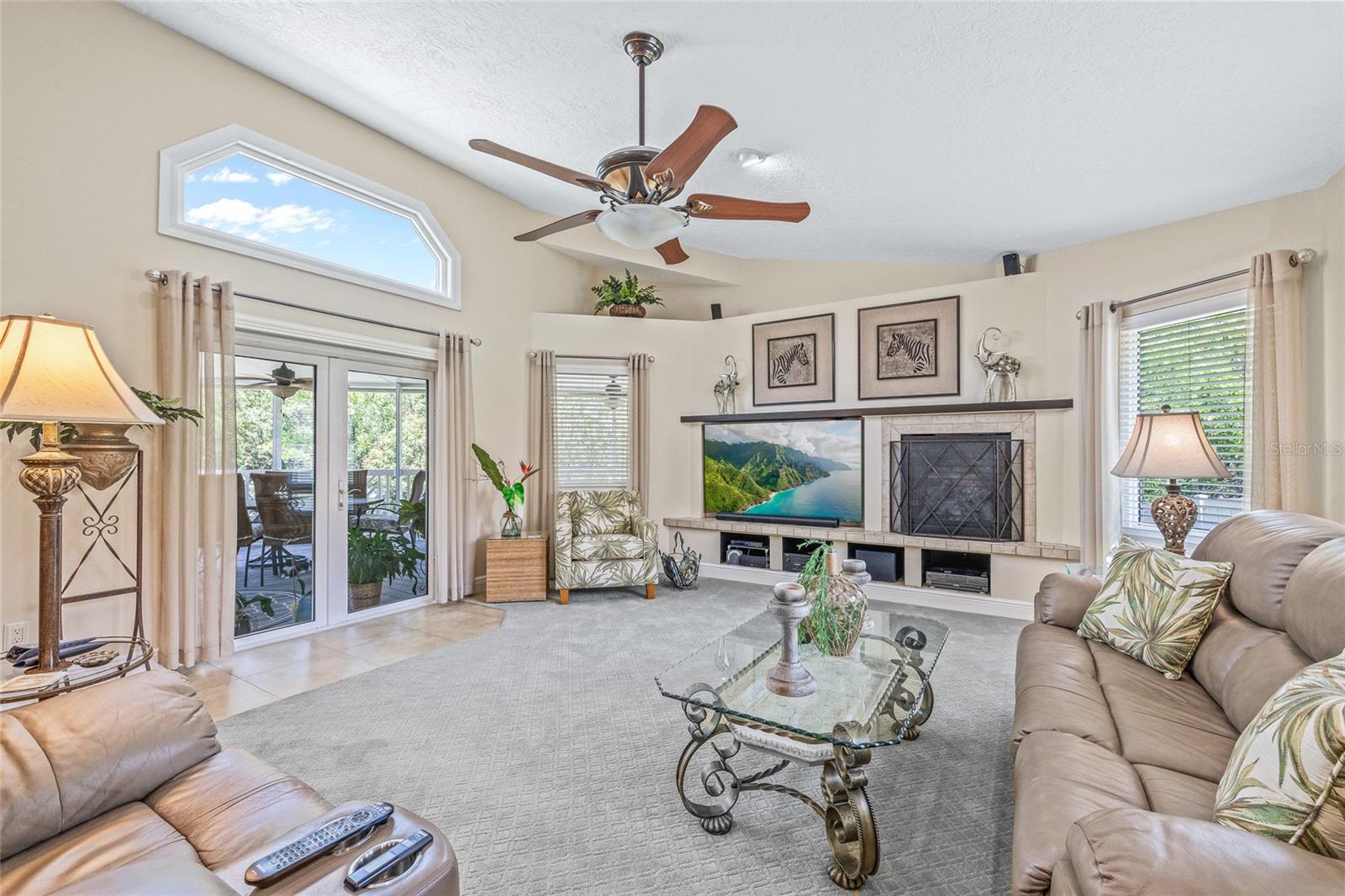 Enjoy tranquil views of the lush preserve from the family room, complete with a warm and inviting gas fireplace.