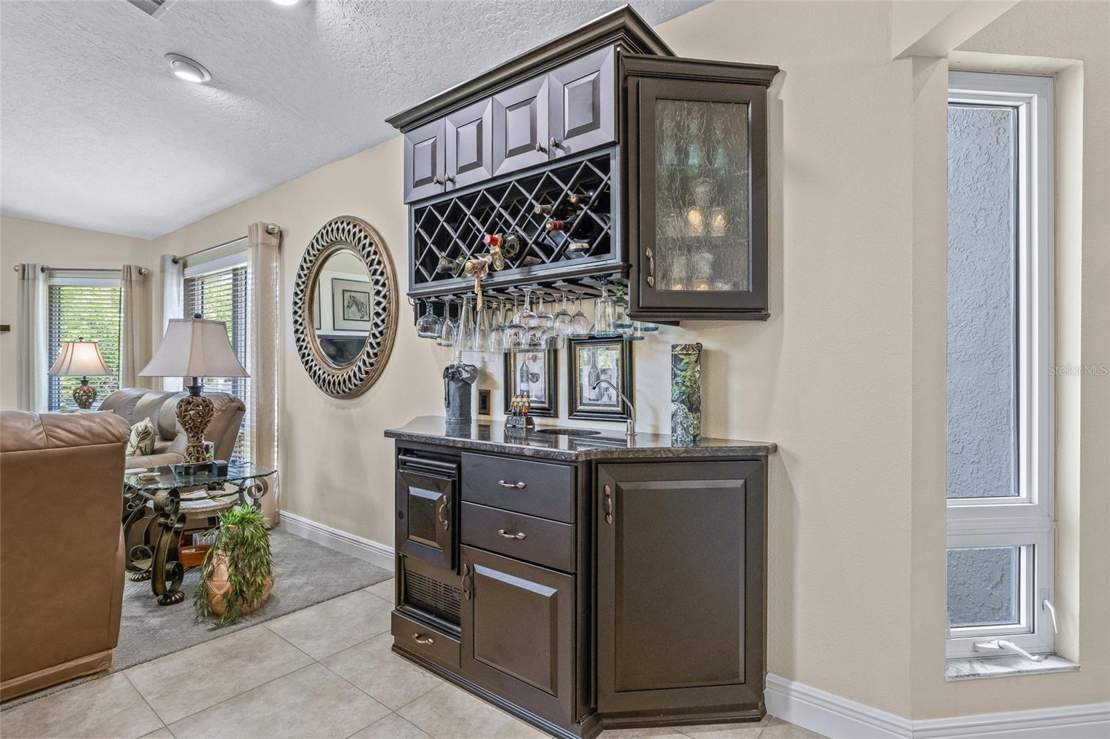 Built-in bar offers a fun and inviting space for entertaining guests.