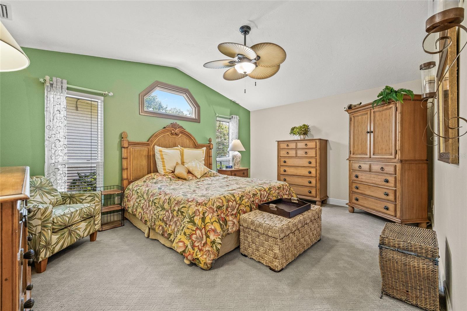 Island-style primary bedroom feels like a premiere room on vacation.
