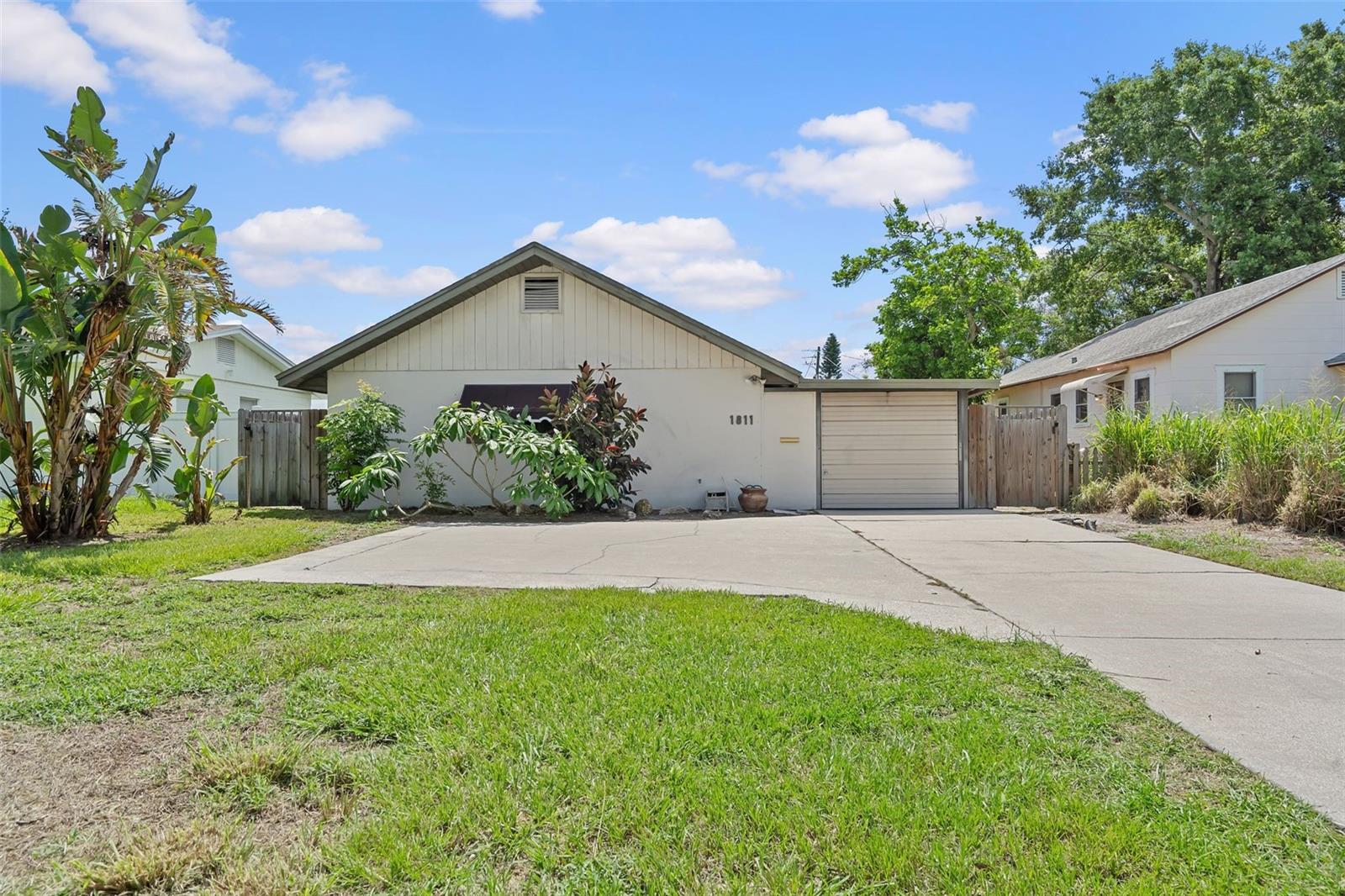 Entry to the home is through the garage or the wood gate on the far right; there is no traditional front entry.