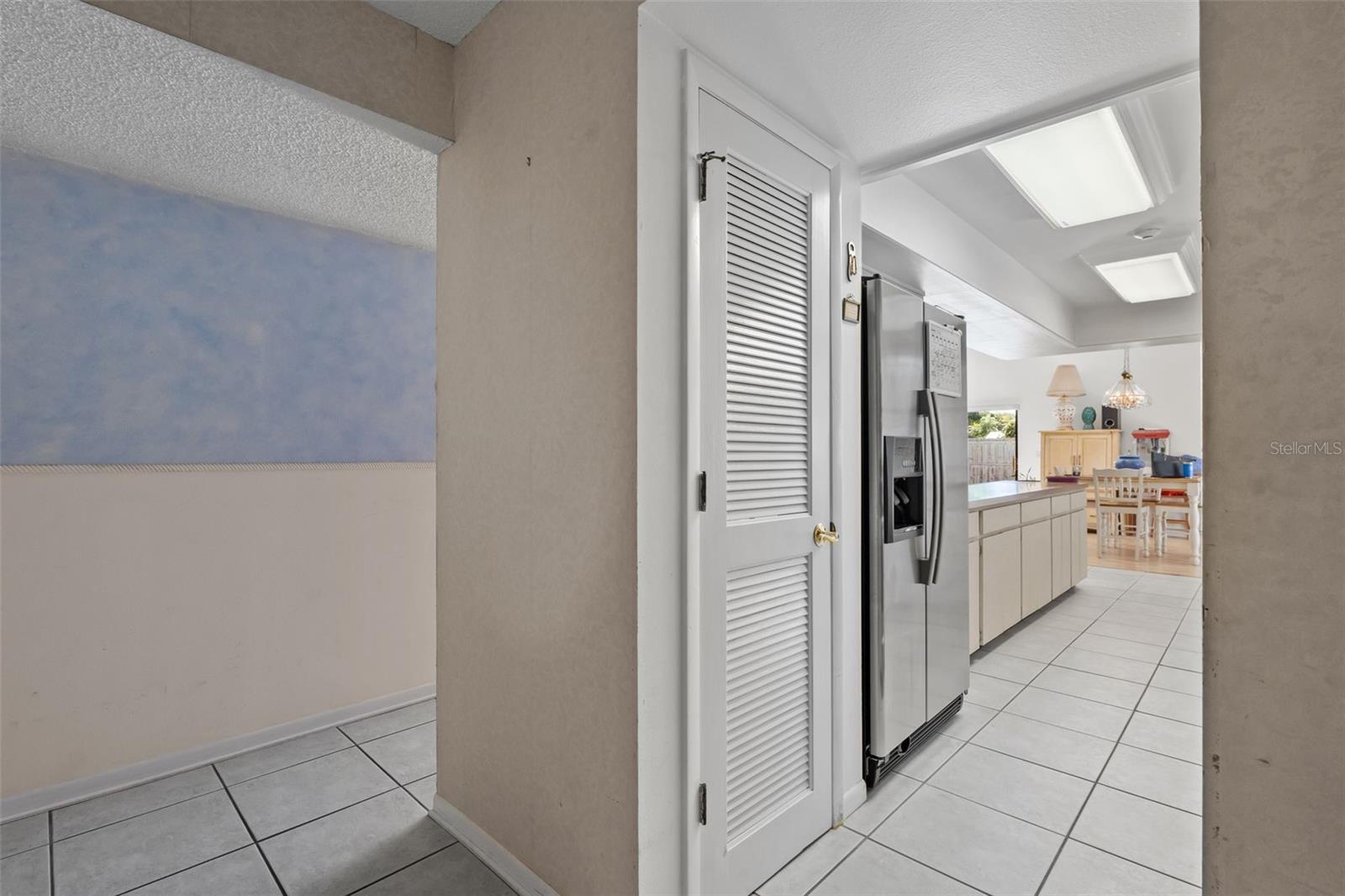 This is a view from the foyer to the galley kitchen; the pantry is next to the fridge