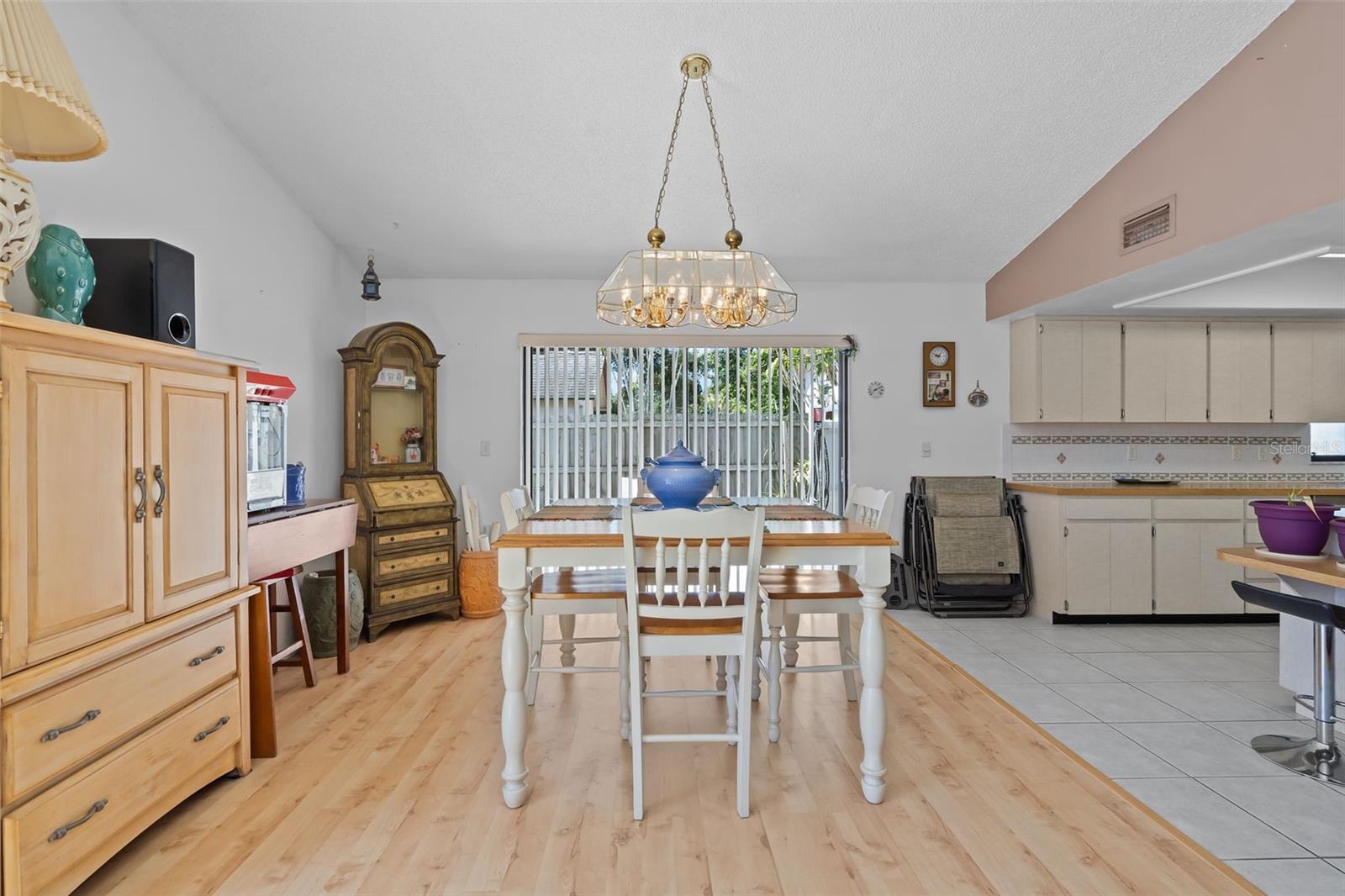 The dinette is located adjacent to the kitchen, offering a cozy spot for dining.