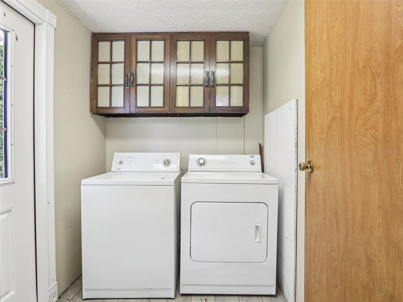 Laundry room, pantry closet on right