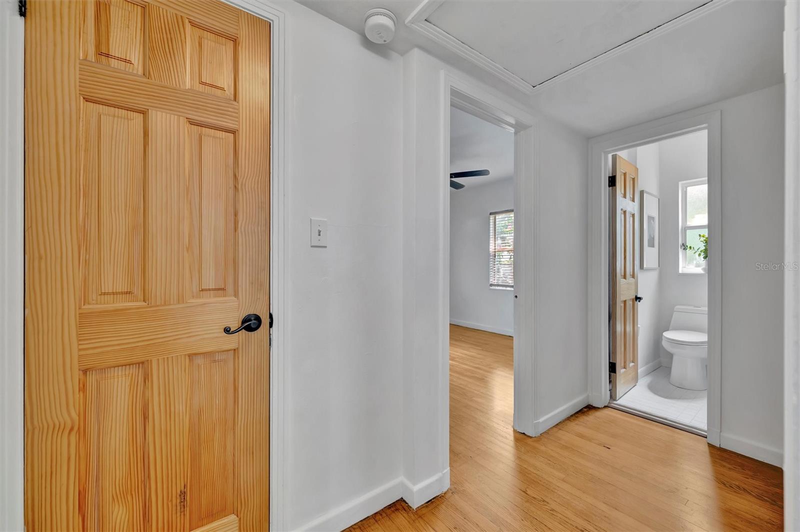 The hallway: the door to the left is a nice size storage, then the next door opens to the guest bedroom, then at the end of the hallway is the bathroom.