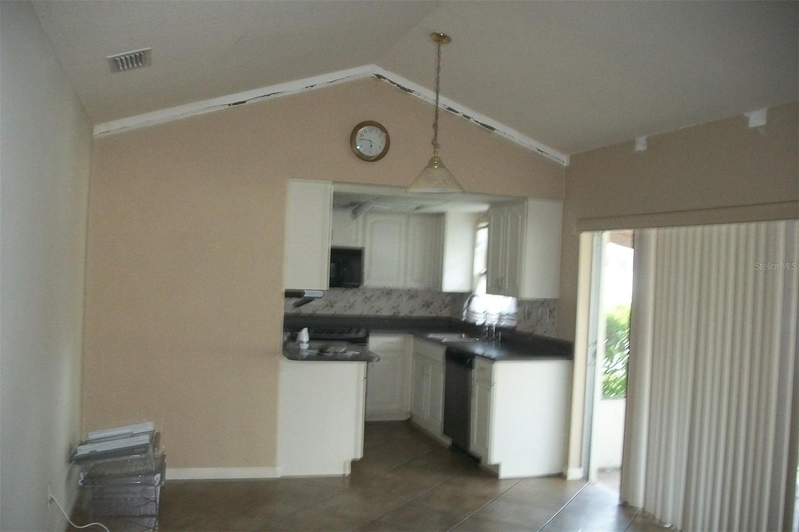 Standing Family room looking into Kitchen